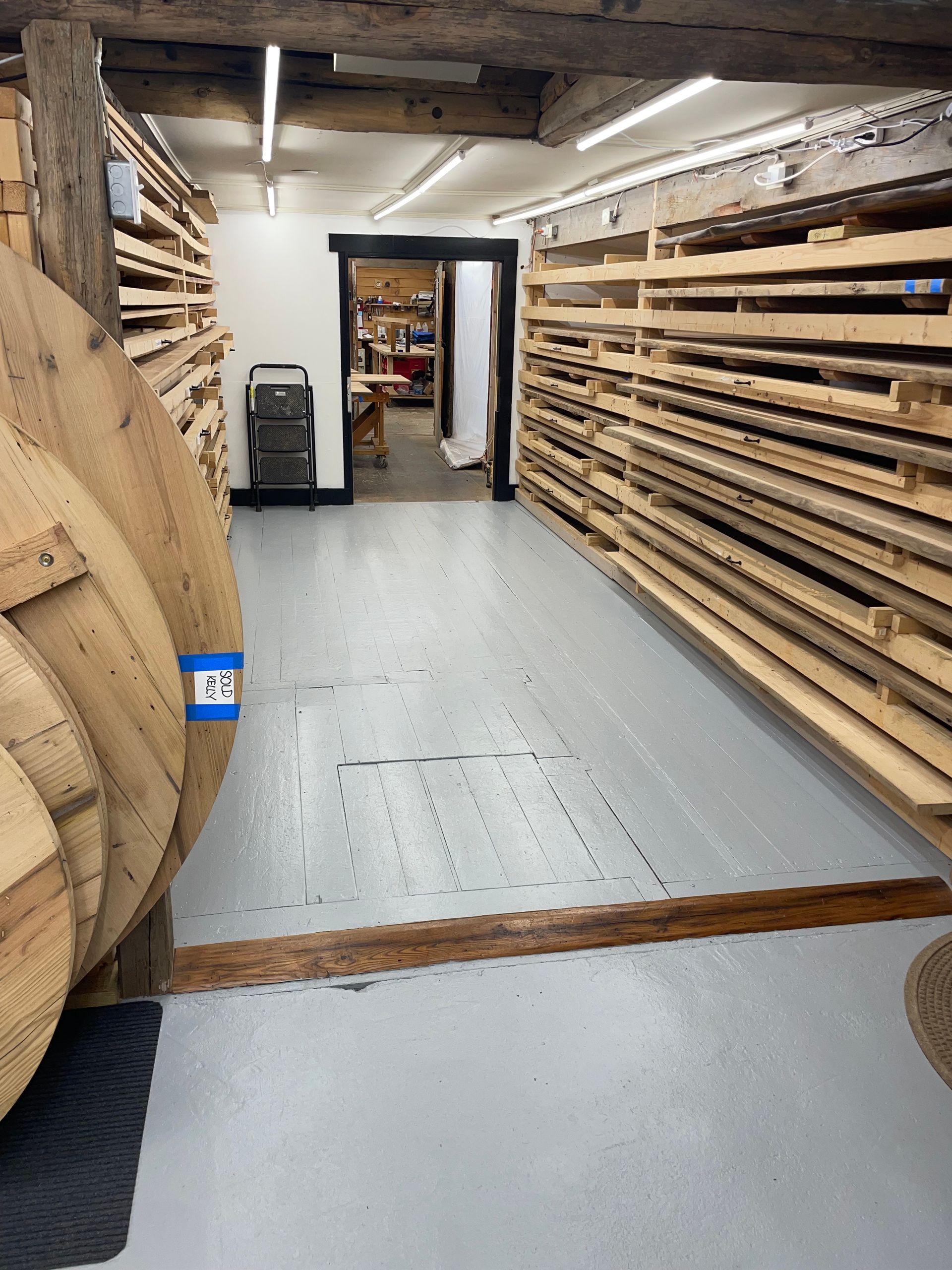 A warehouse filled with lots of wooden pallets