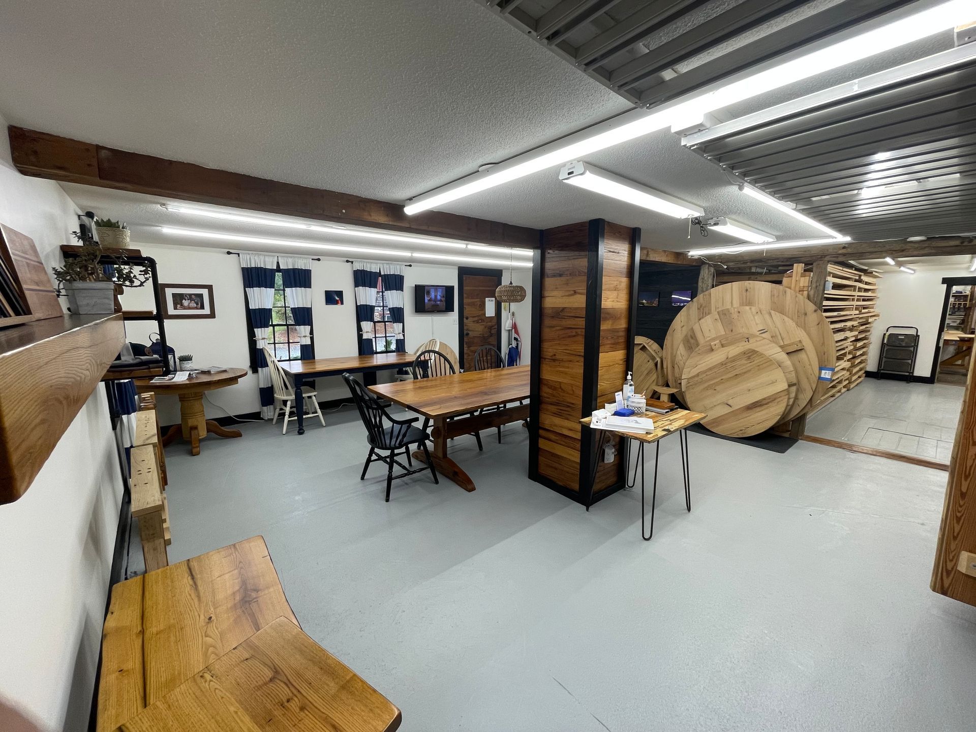 A large room filled with wooden tables and chairs.