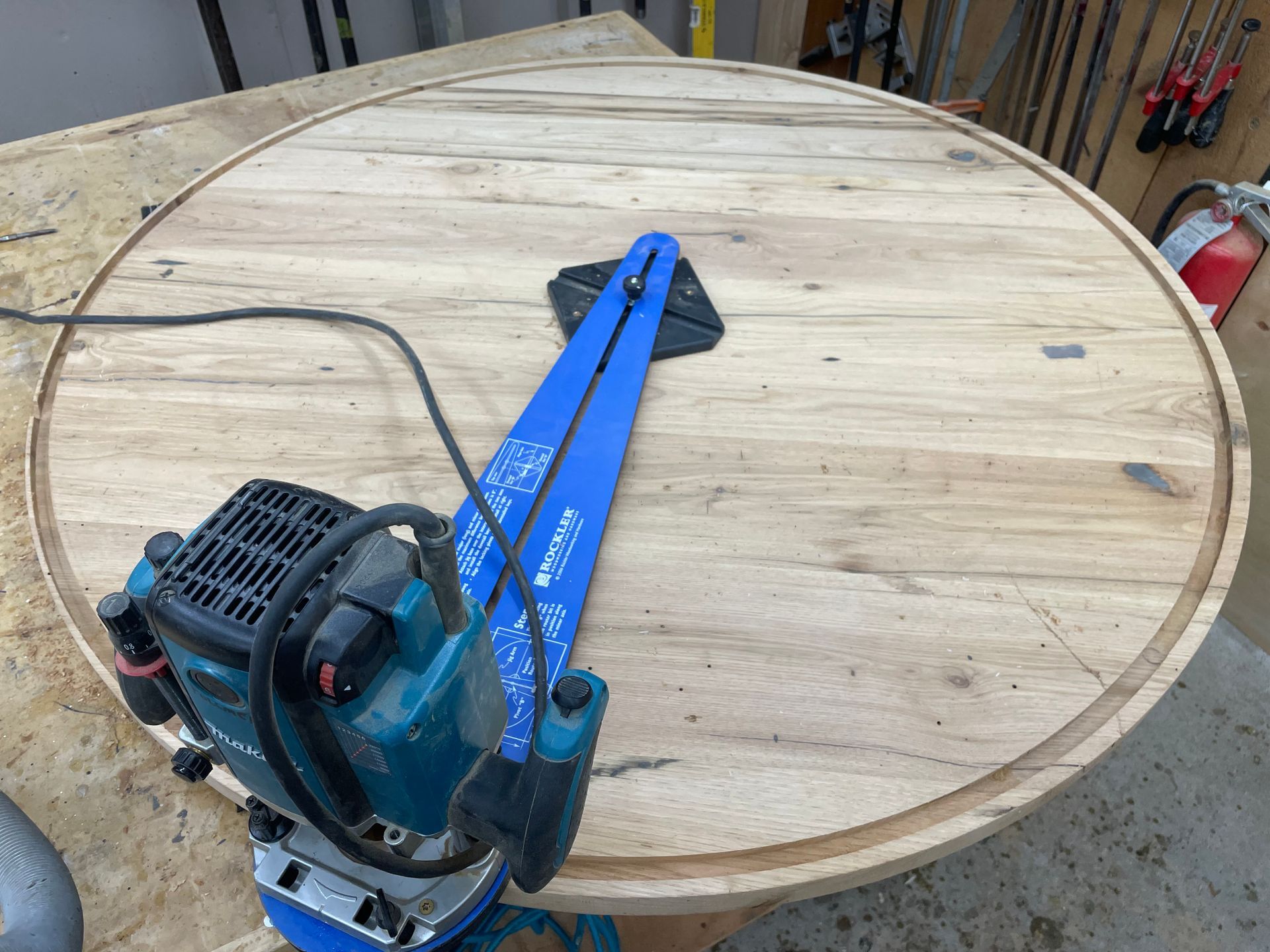A router is sitting on top of a wooden table.