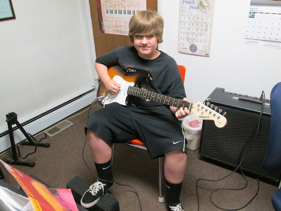 playing electric guitar