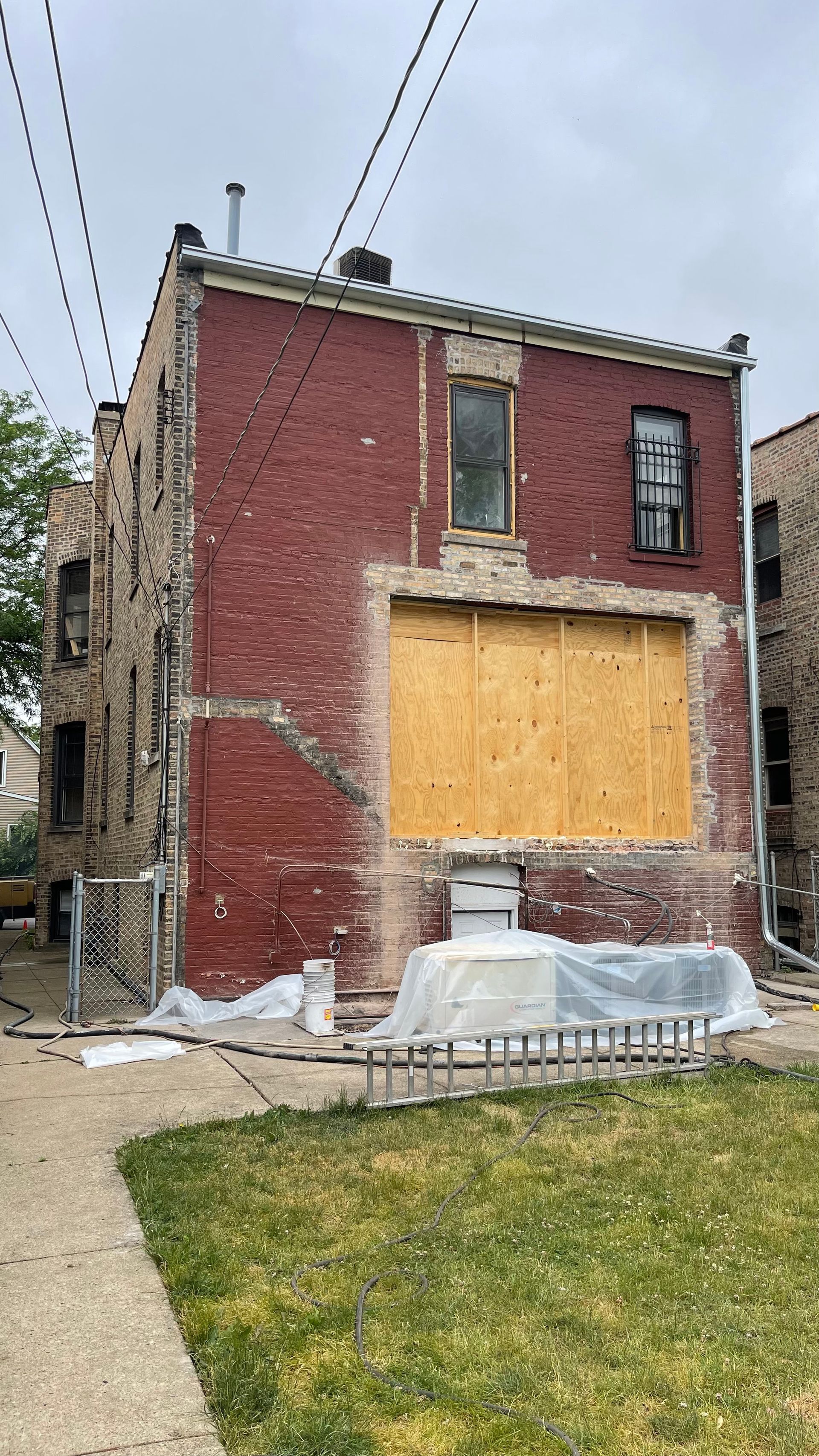 The inside of a building under construction with wooden beams.