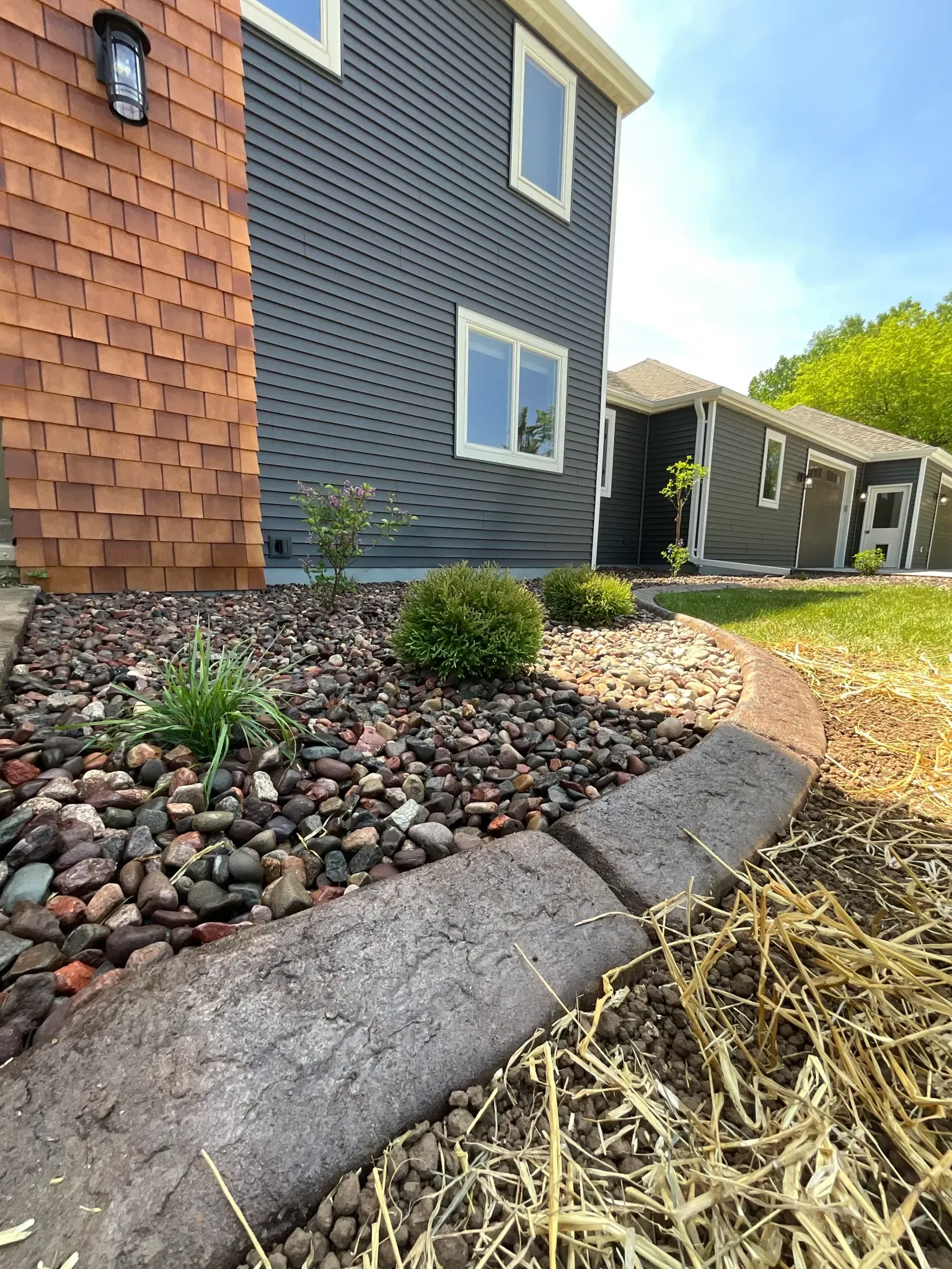 A house with a lot of rocks in front of it.