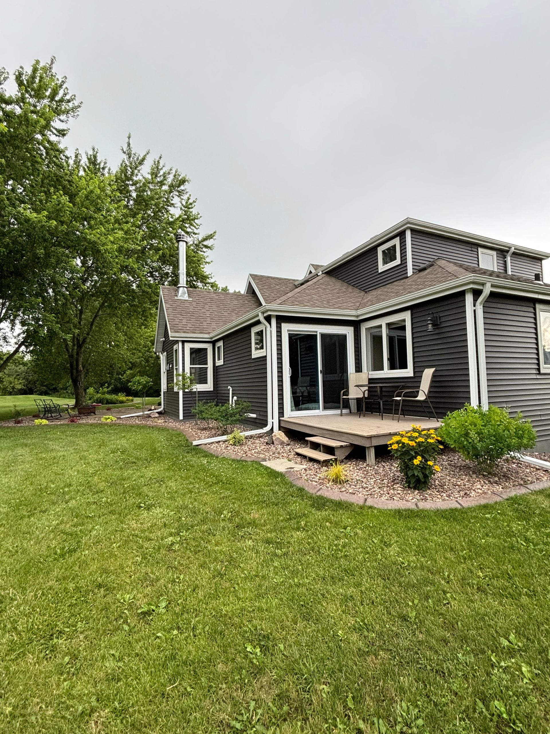 A large house with a large lawn in front of it.