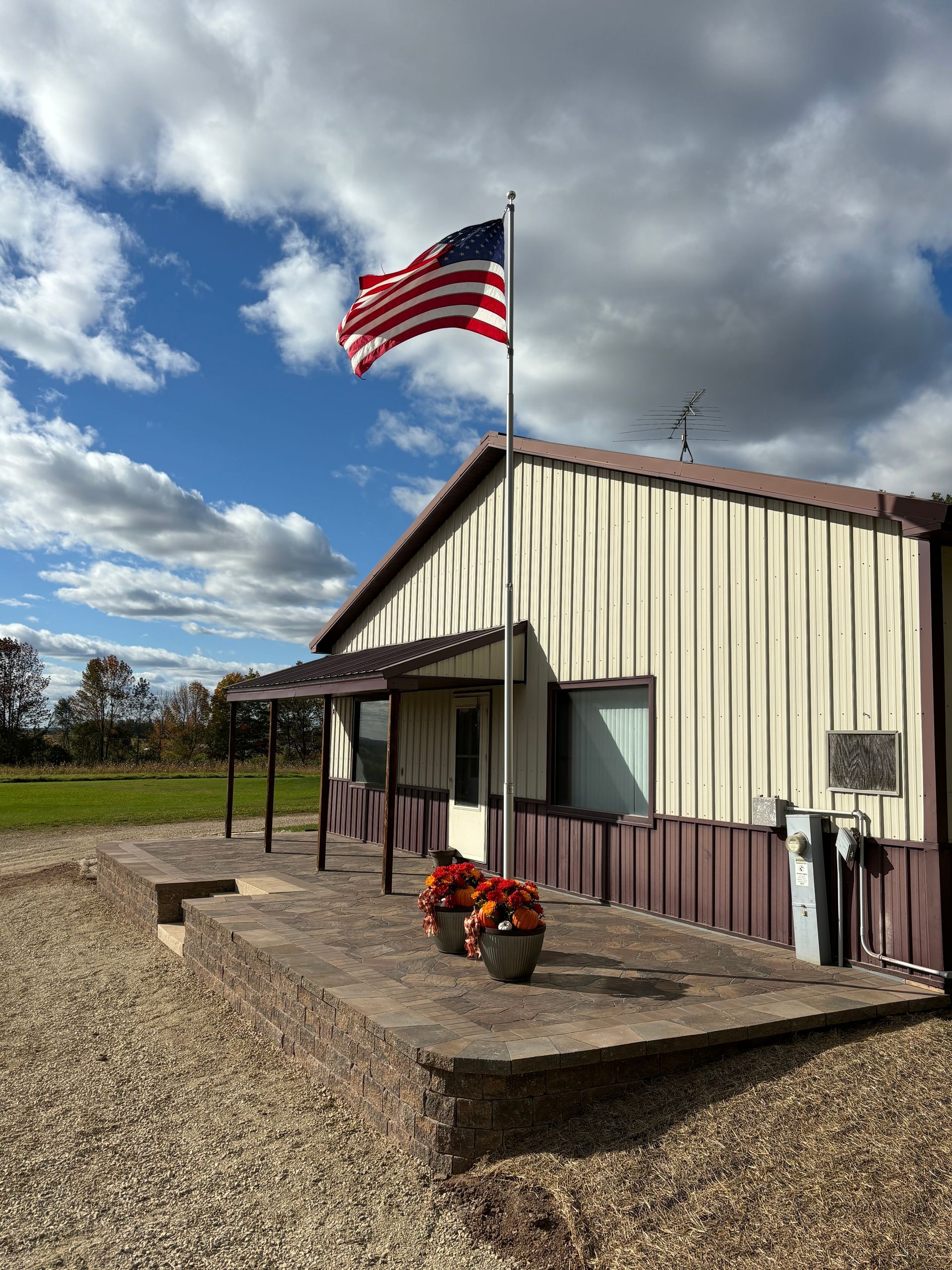 An american flag is flying in front of a building.
