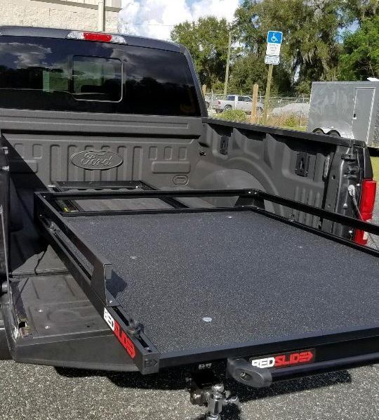 A ford truck with a slide out bed