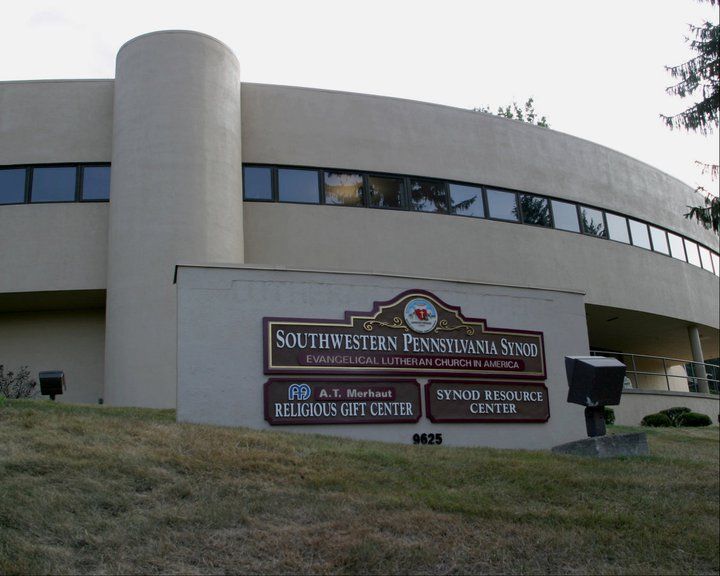 Southwestern Pennsylvania Synod building with sign on lawn.