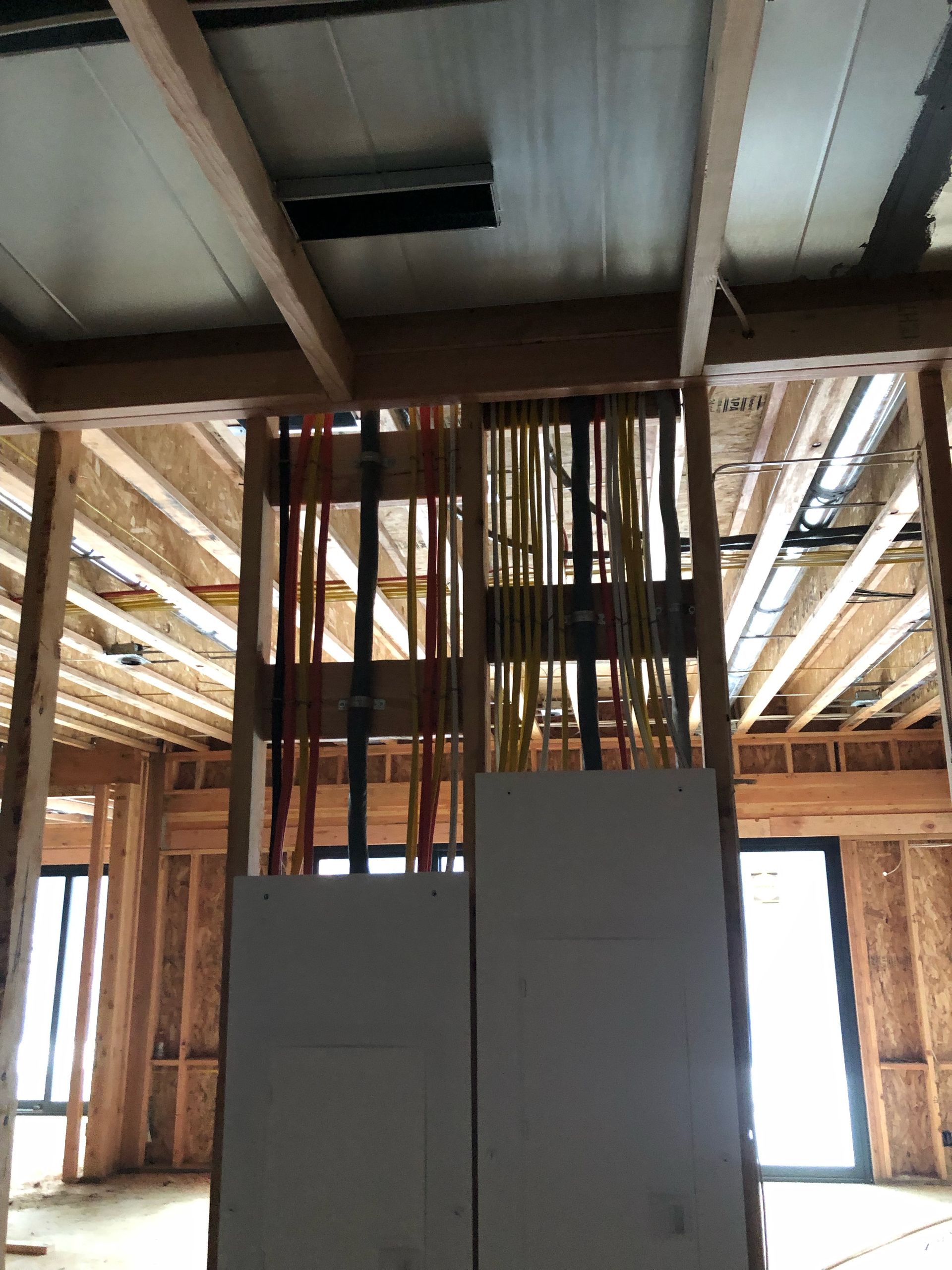 A building under construction with a lot of wooden beams.