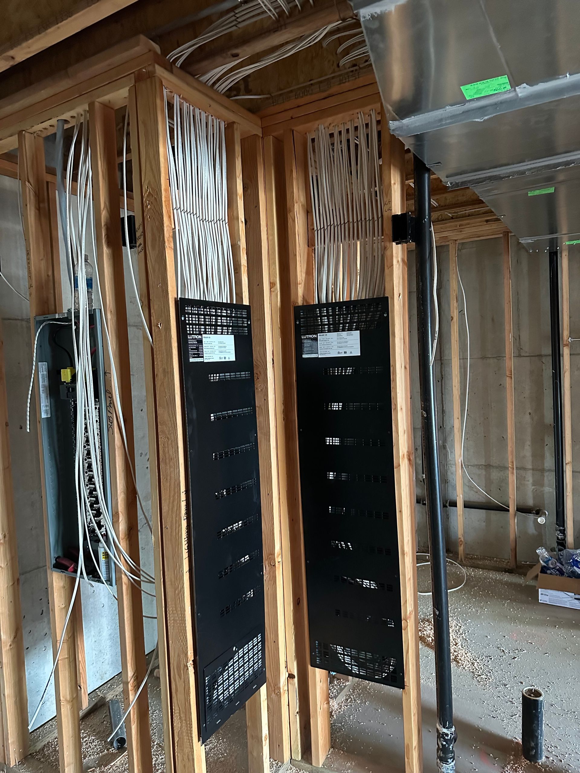 A room with a lot of wooden beams and black boards on the wall.