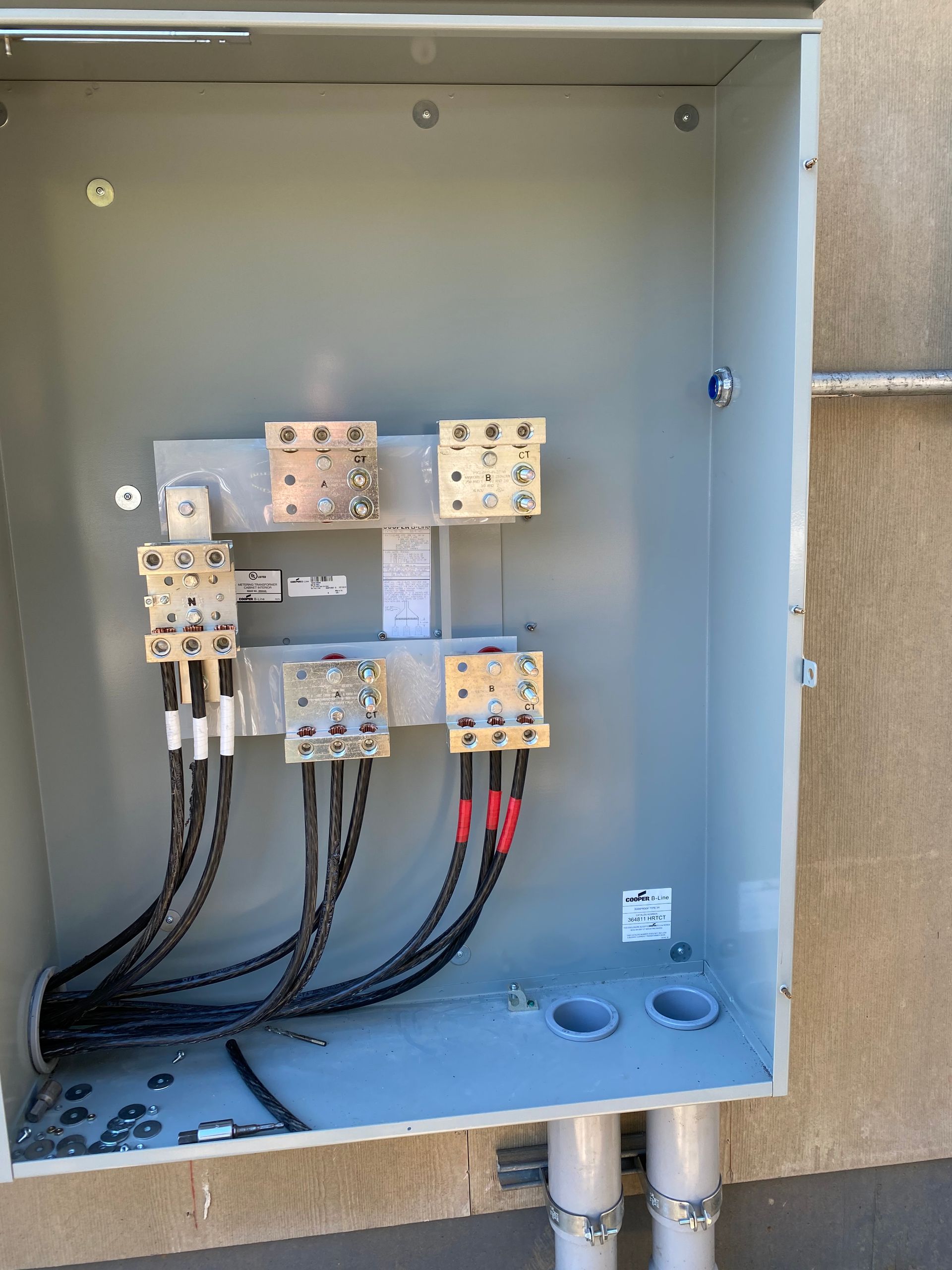 An electrical box with a lot of wires coming out of it.