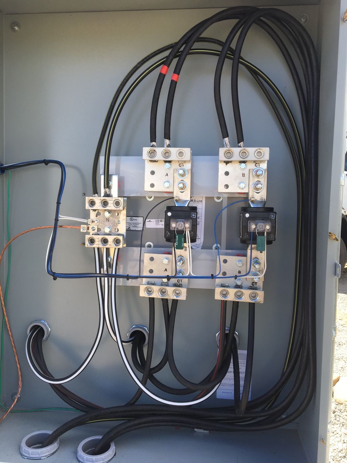 A box with a lot of wires coming out of it