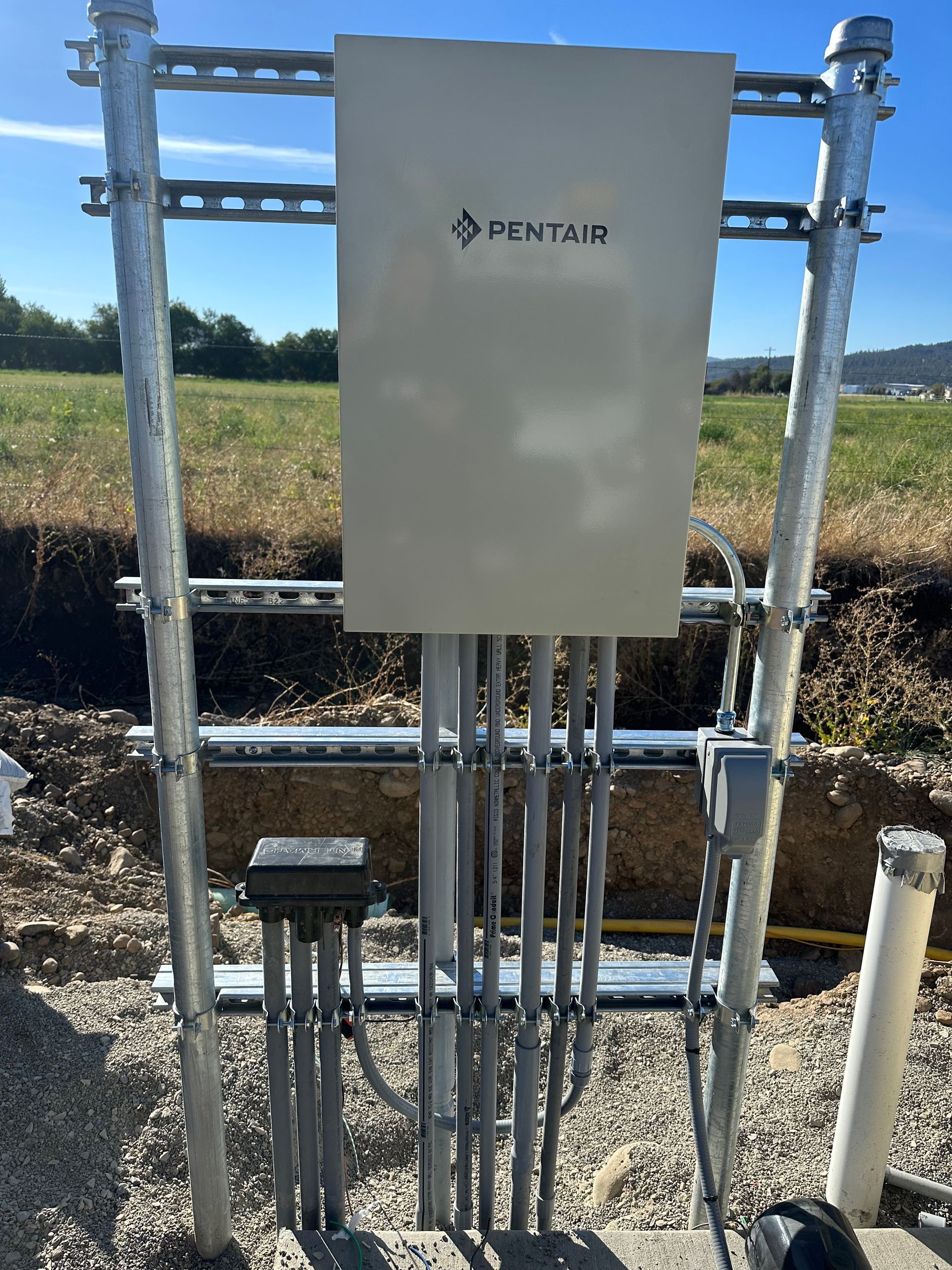 A pentair box is sitting on top of a metal structure