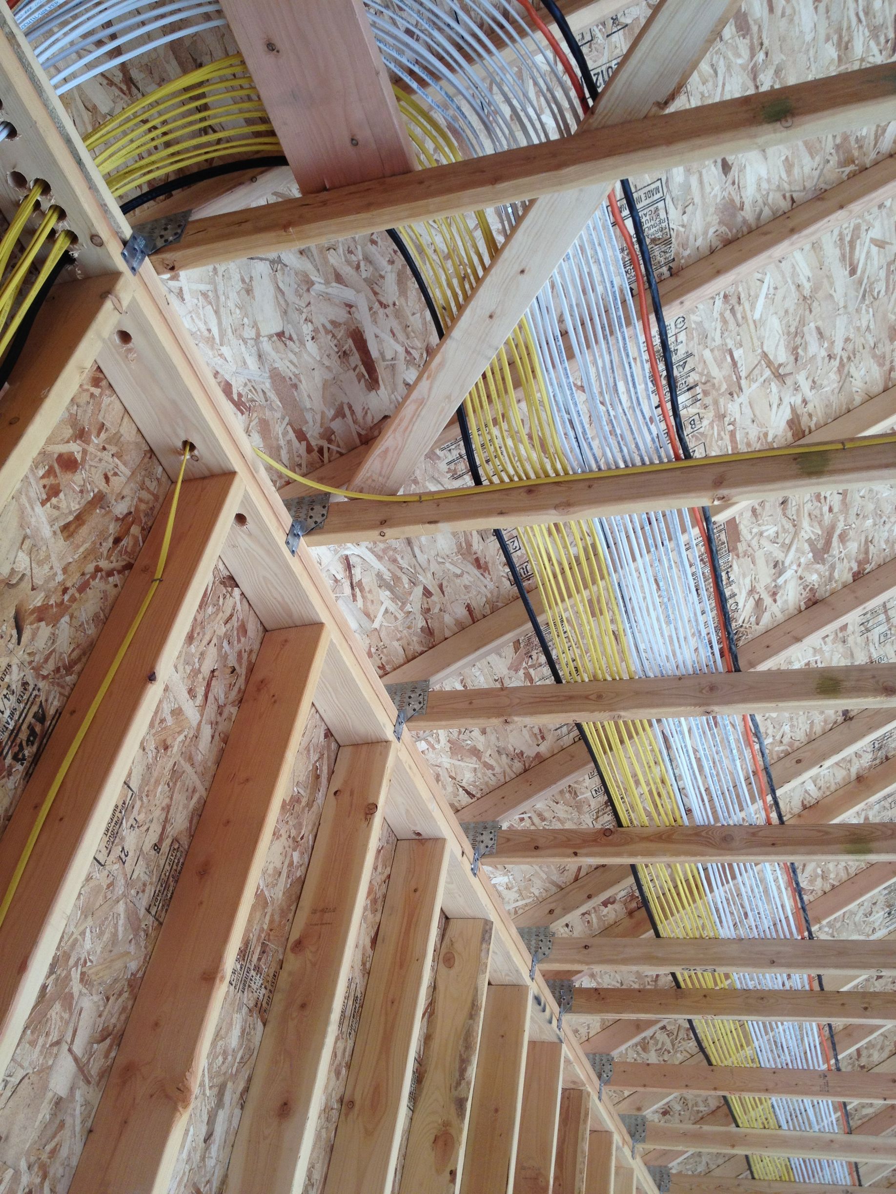 A ceiling with a lot of wires coming out of it