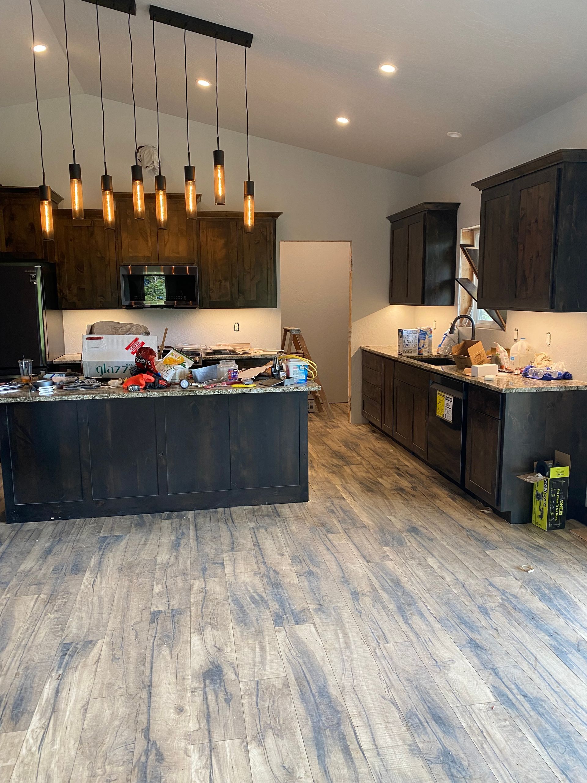 A kitchen with a large island and lots of cabinets
