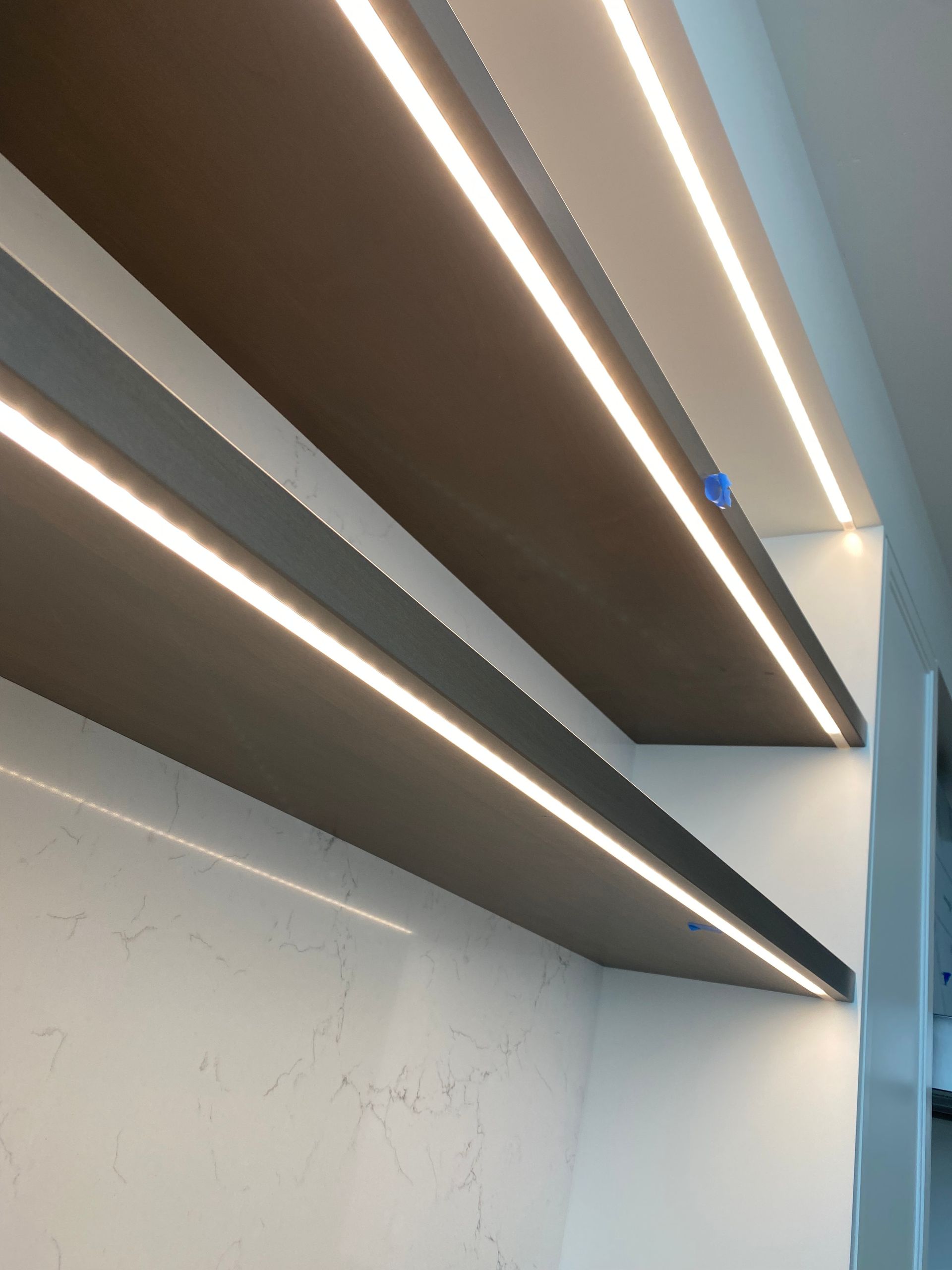 A close up of a shelf with lights on it