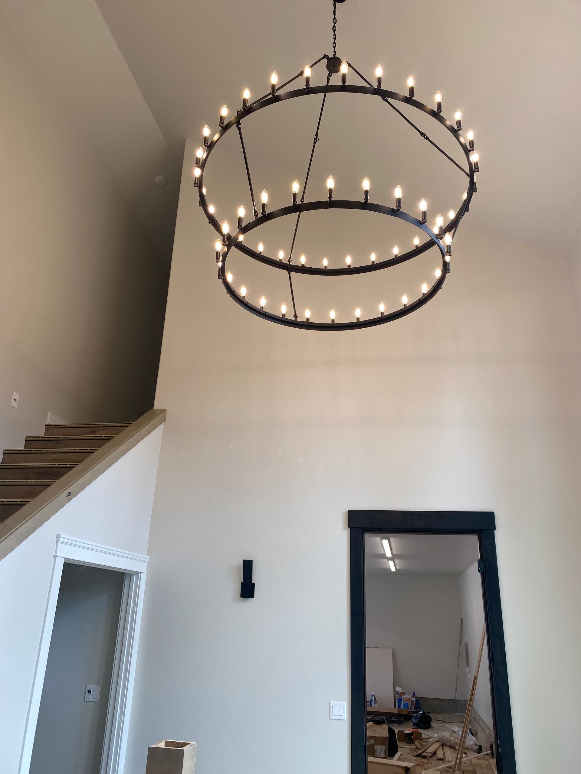 A large chandelier is hanging from the ceiling in a room