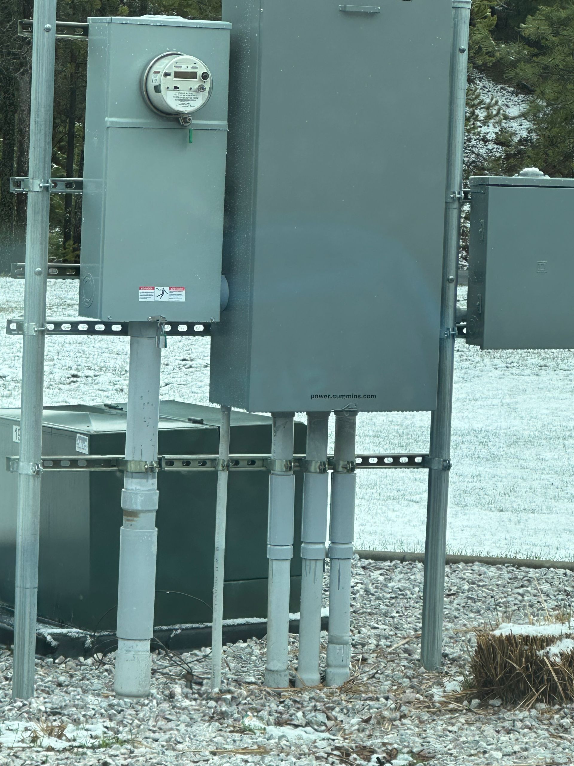 An electrical box with a meter on top of it