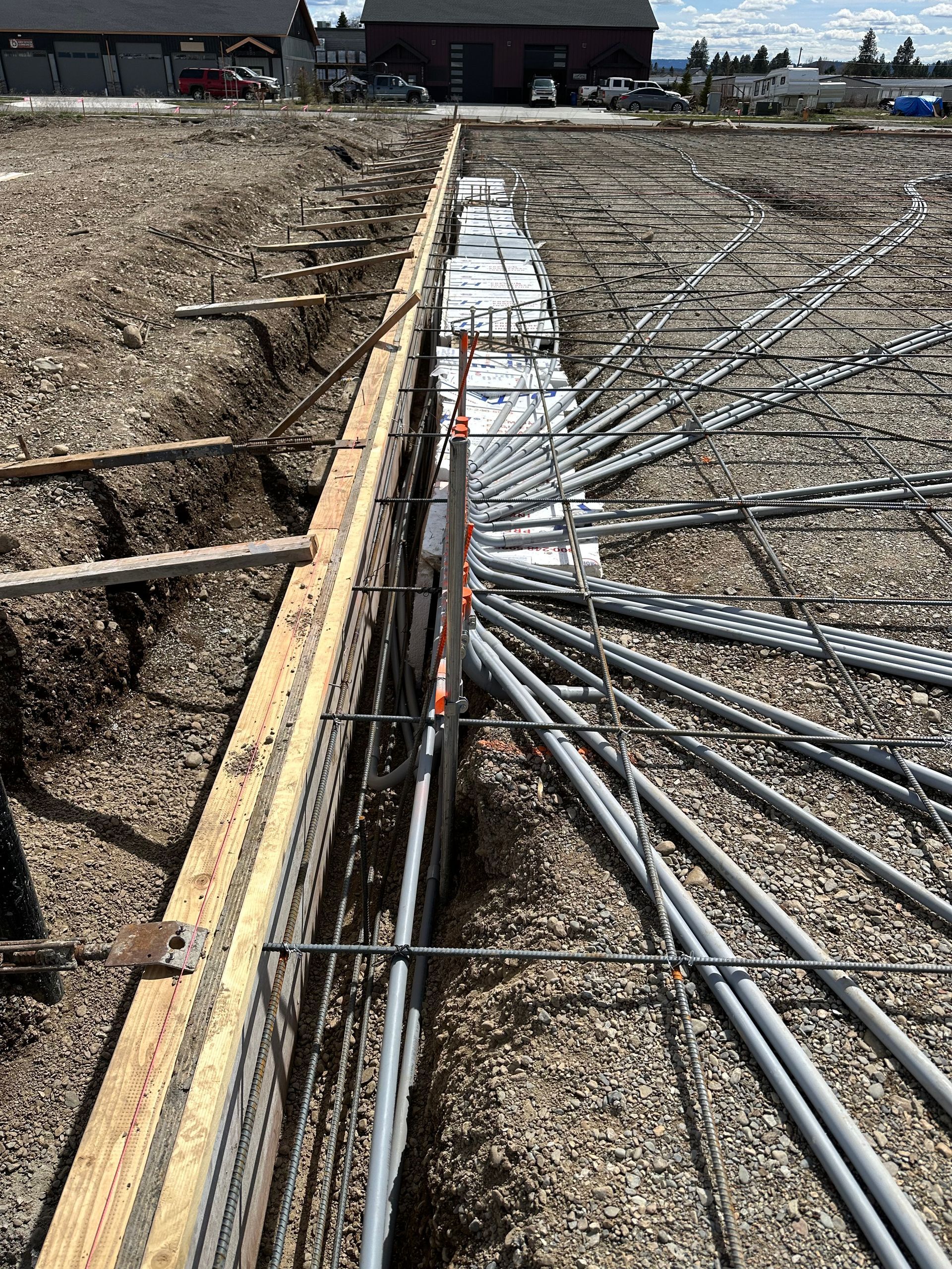 A bunch of electrical wires are coming out of the ground.