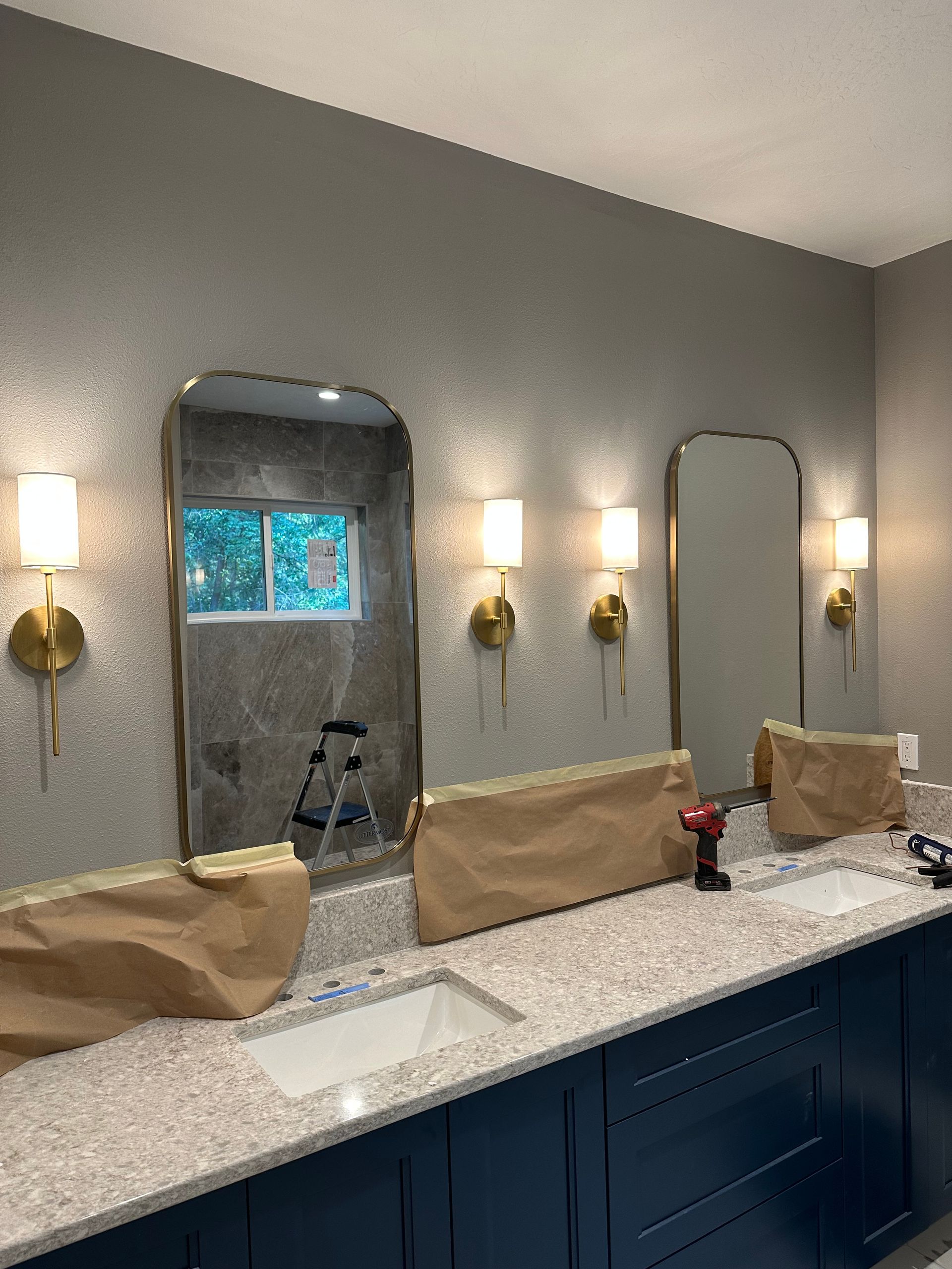 A bathroom with a lot of sinks and mirrors.