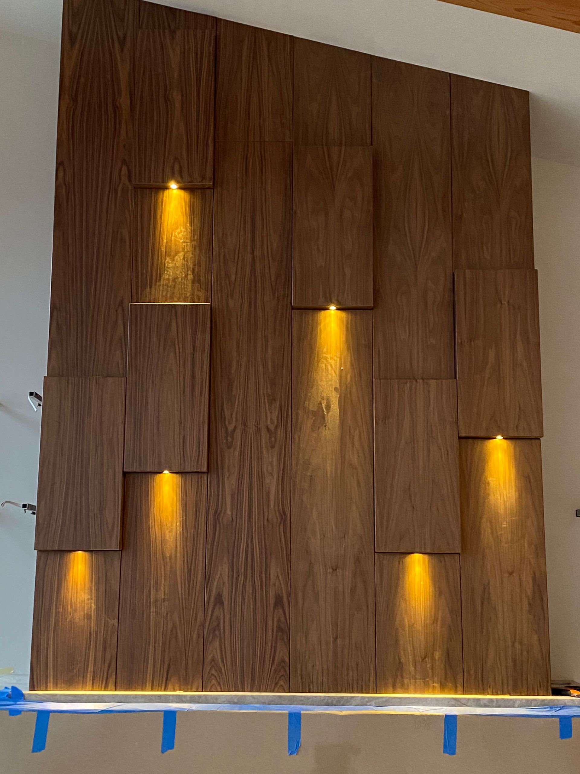 A wooden wall with a lot of lights on it