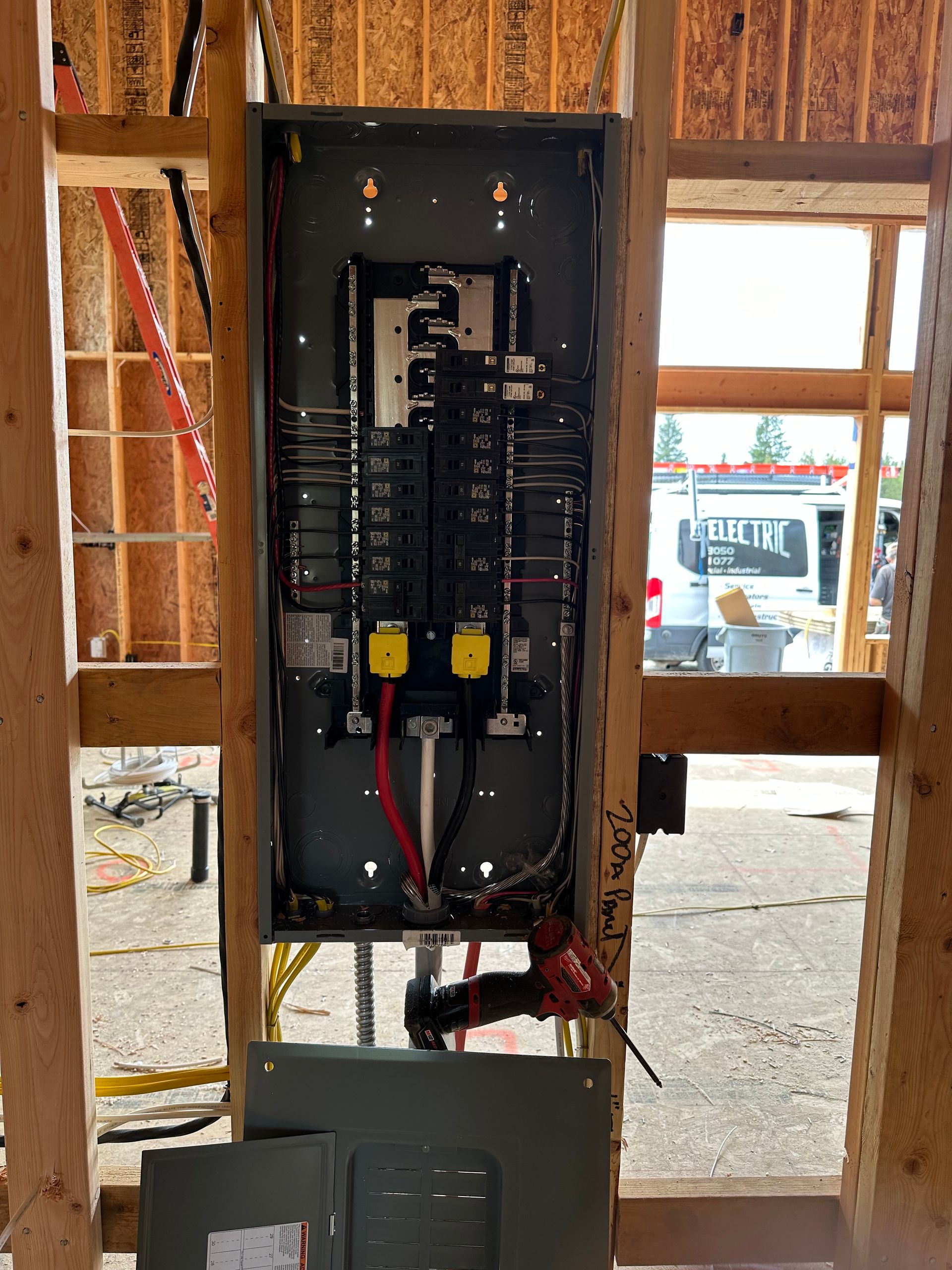 A electrical box is being installed in a building under construction.