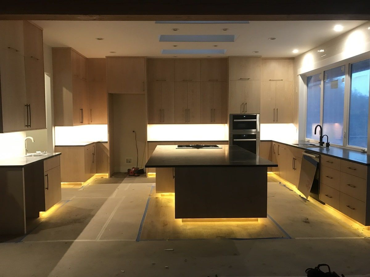 A kitchen with a large island and lots of cabinets