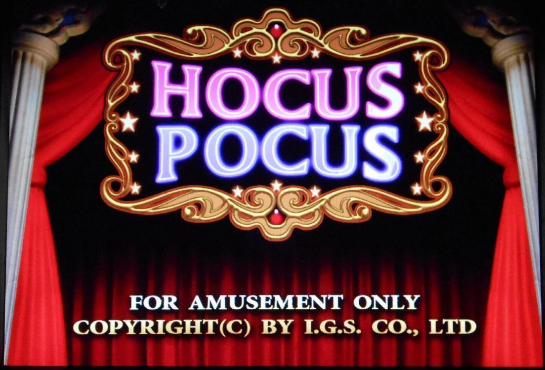 “Hocus Pocus” title card on a red-curtain stage with ornate gold trim and copyright text