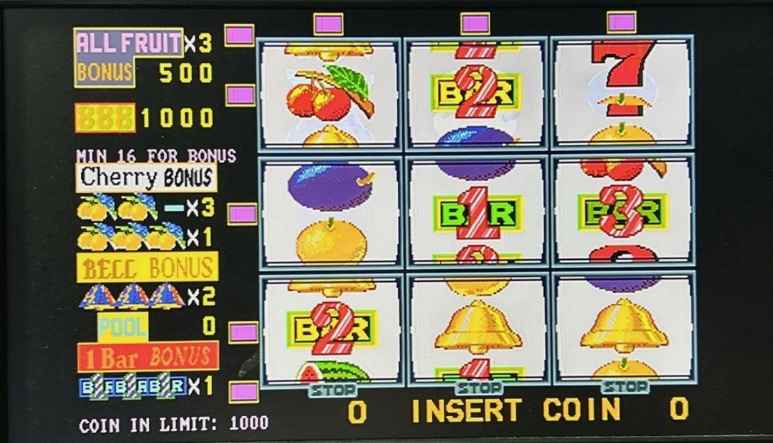 Arcade slot machine display with fruit symbols and “INSERT COIN” message on a black screen