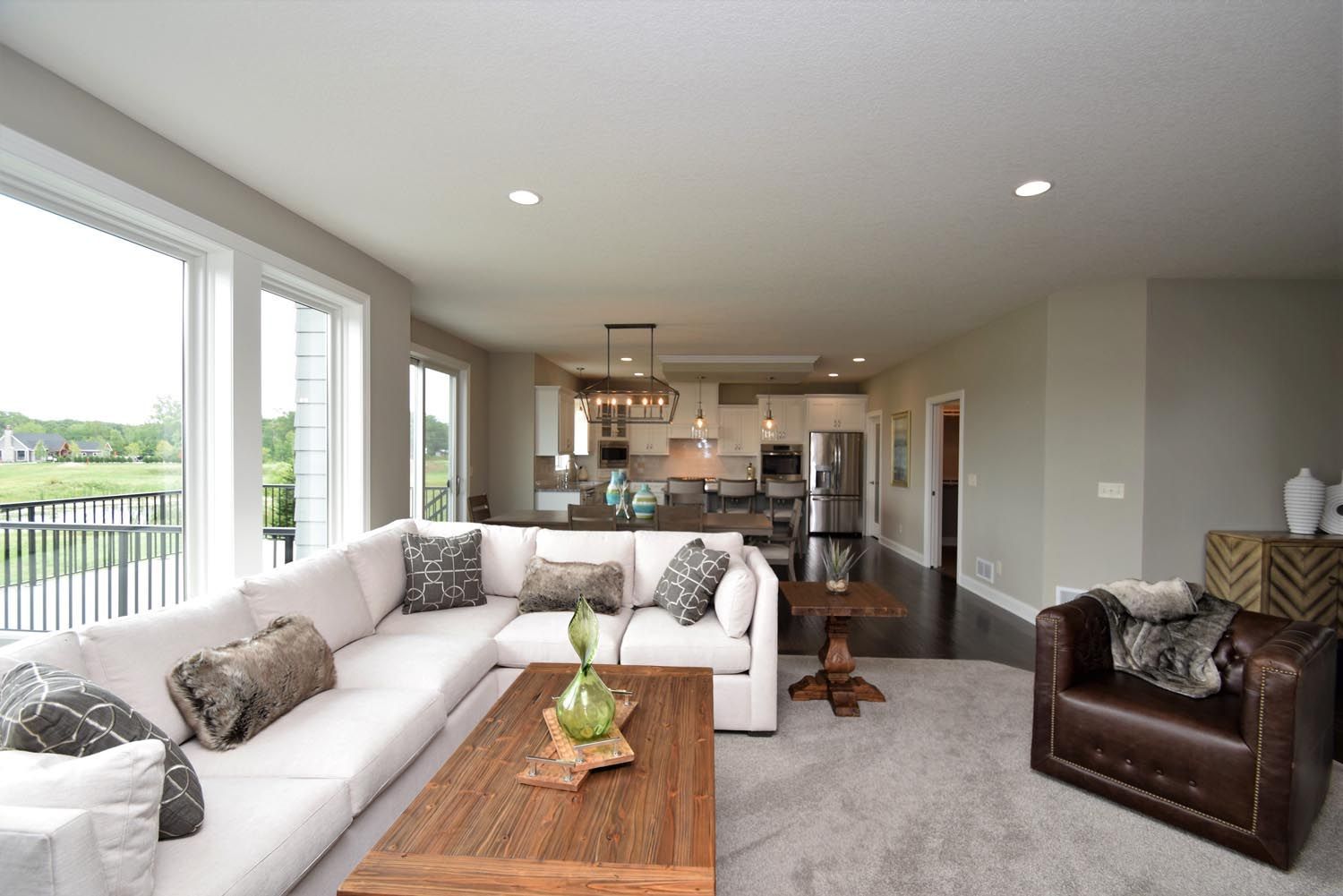 a living room with a large sectional couch and a coffee table