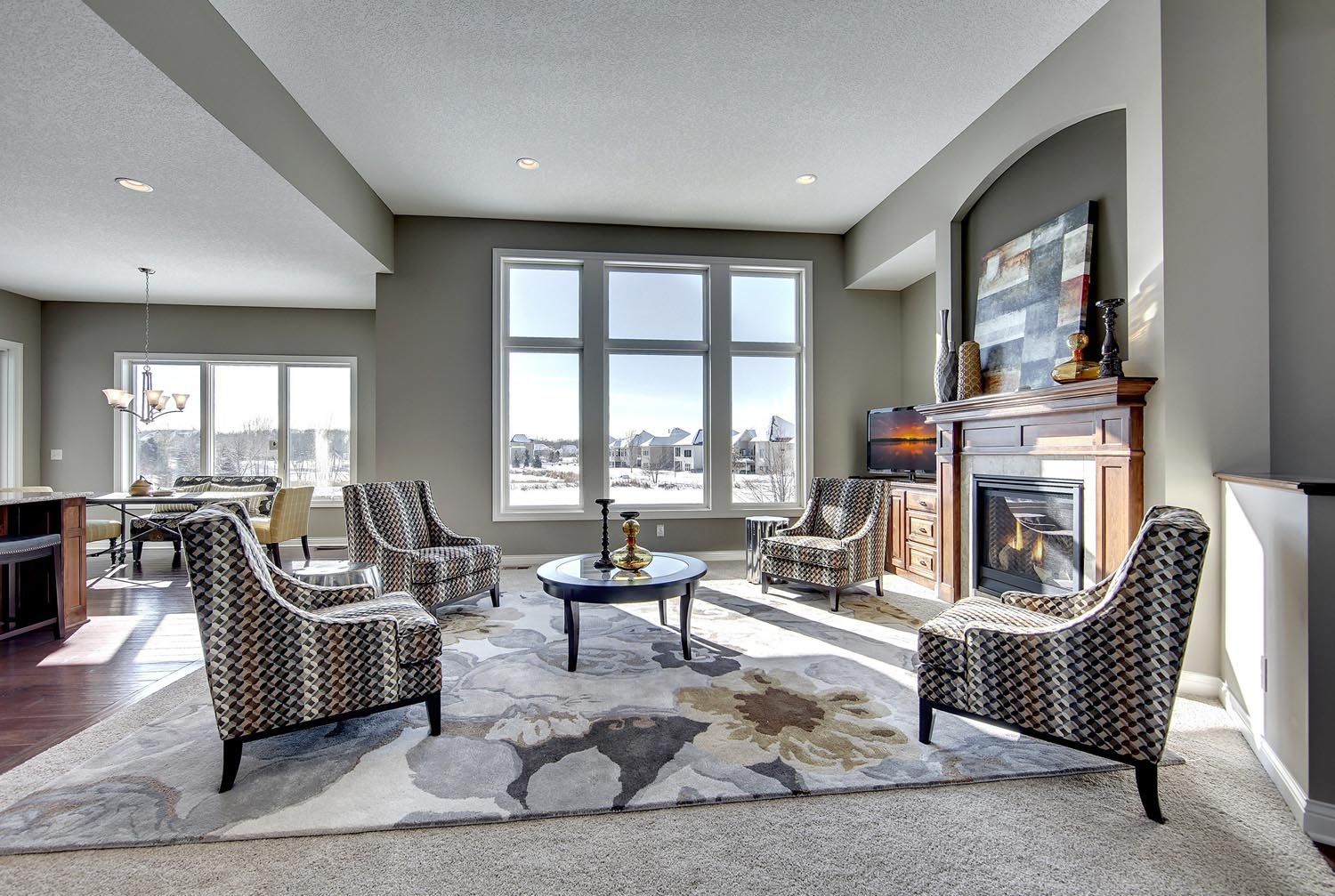 a living room filled with furniture and a fireplace