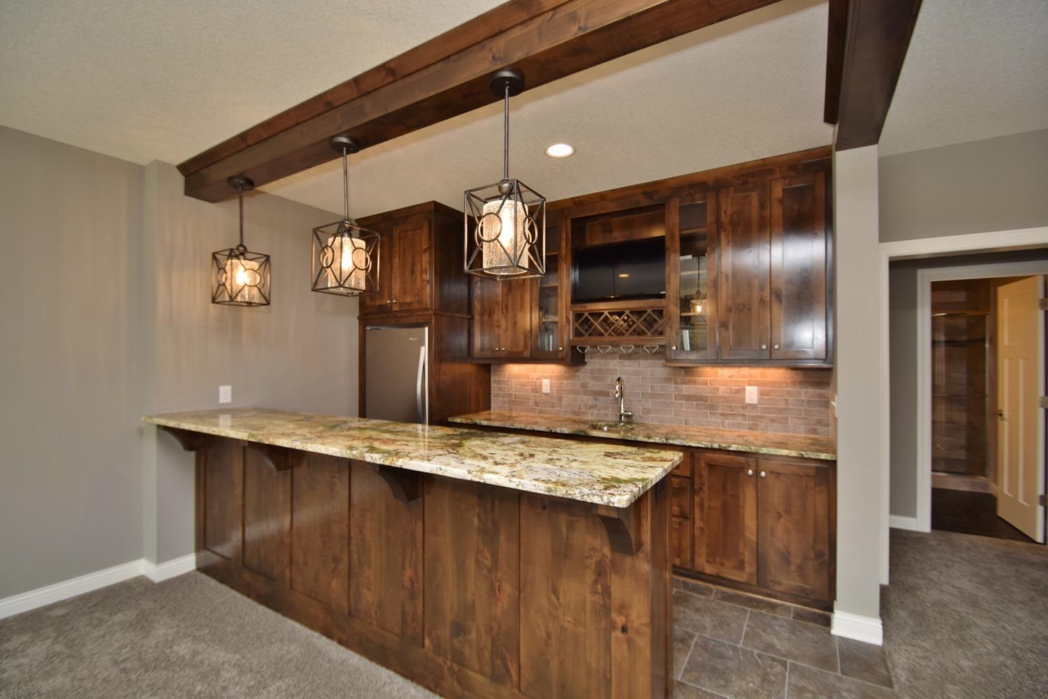 a kitchen with wooden cabinets and a granite counter top