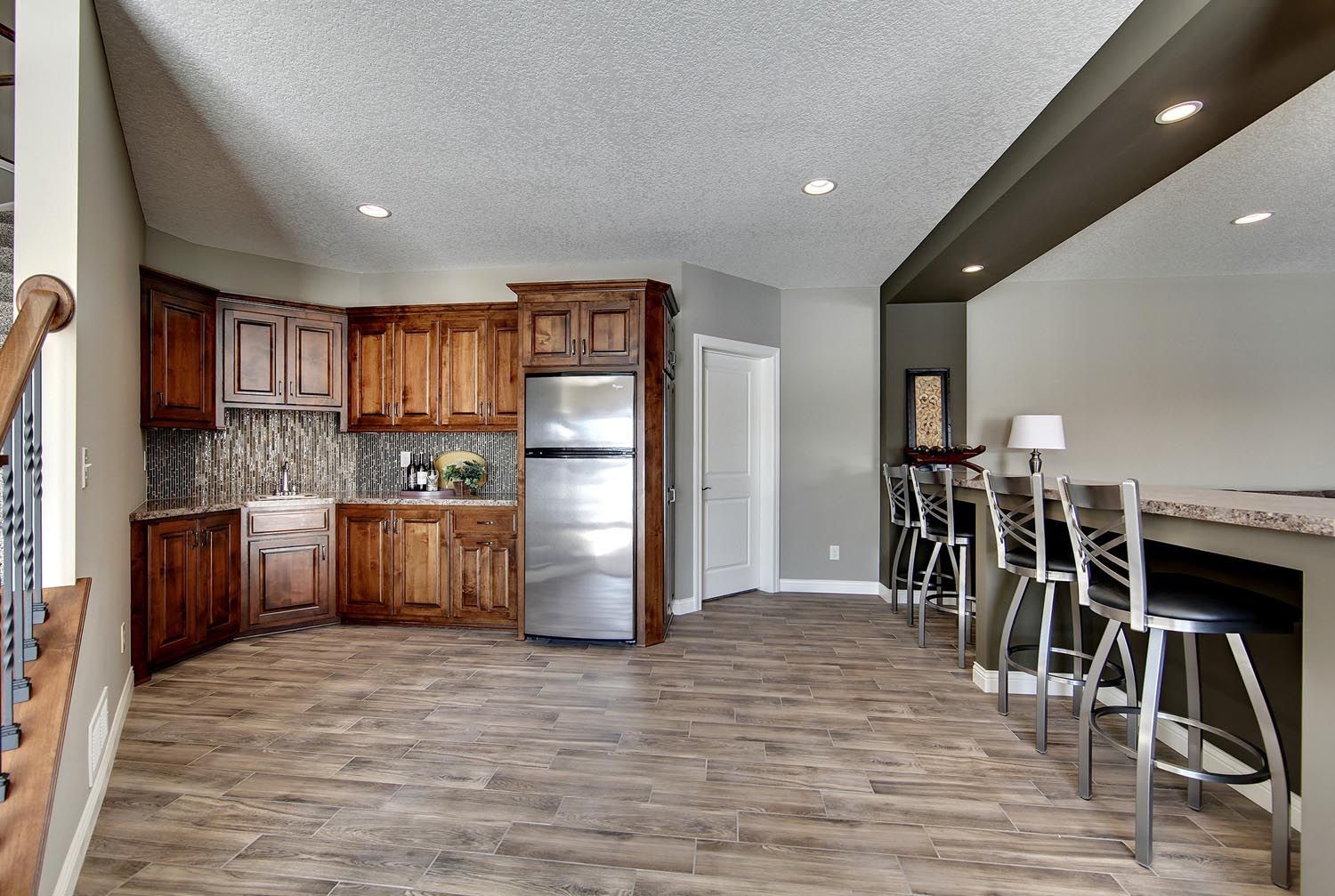 a kitchen with stainless steel appliances and wooden cabinets