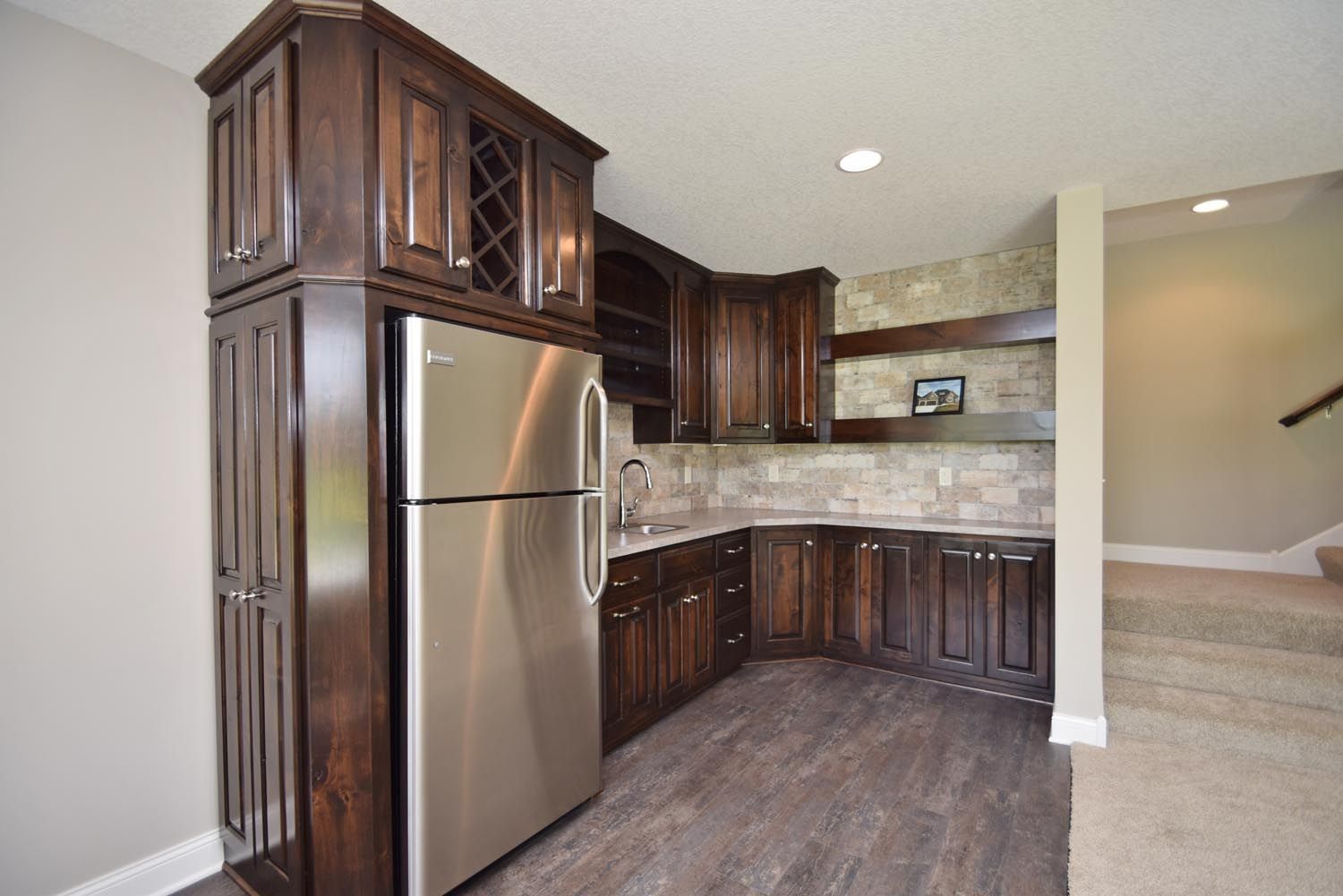 a kitchen with stainless steel appliances and wooden cabinets