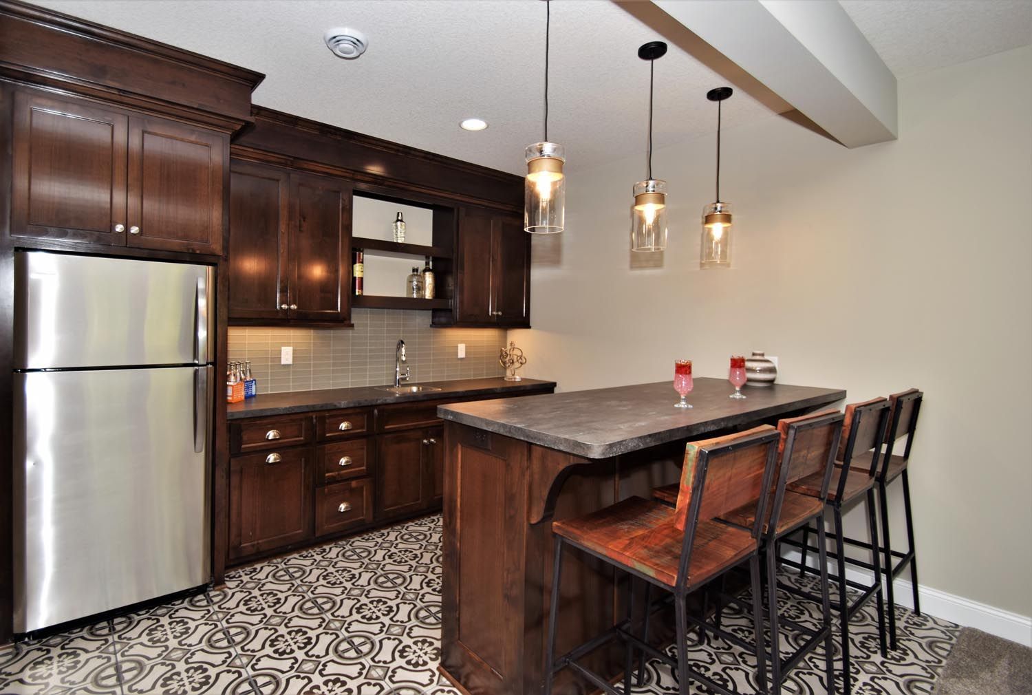 a kitchen with stainless steel appliances and wooden cabinets