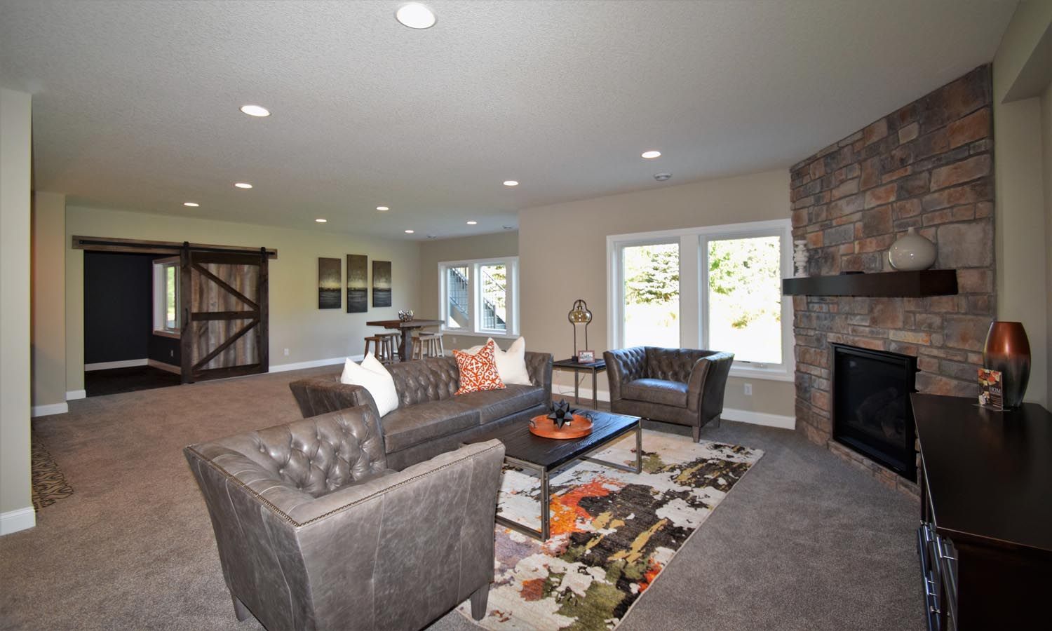 a living room filled with furniture and a fireplace