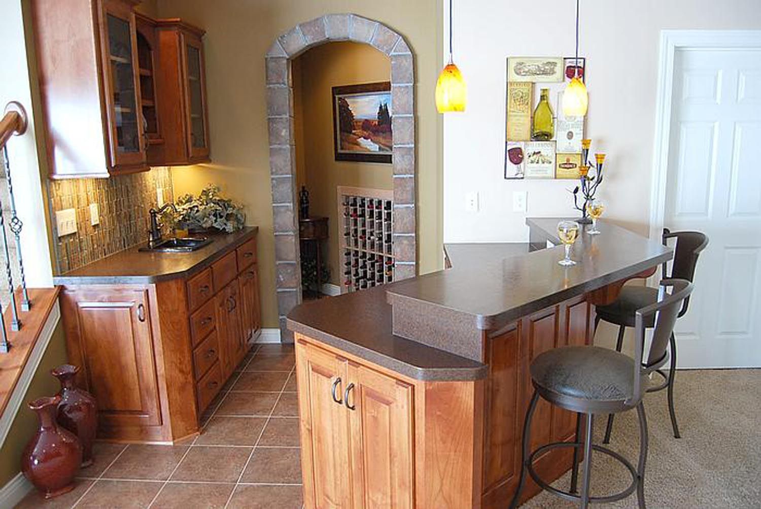 a kitchen with wooden cabinets and a granite counter top