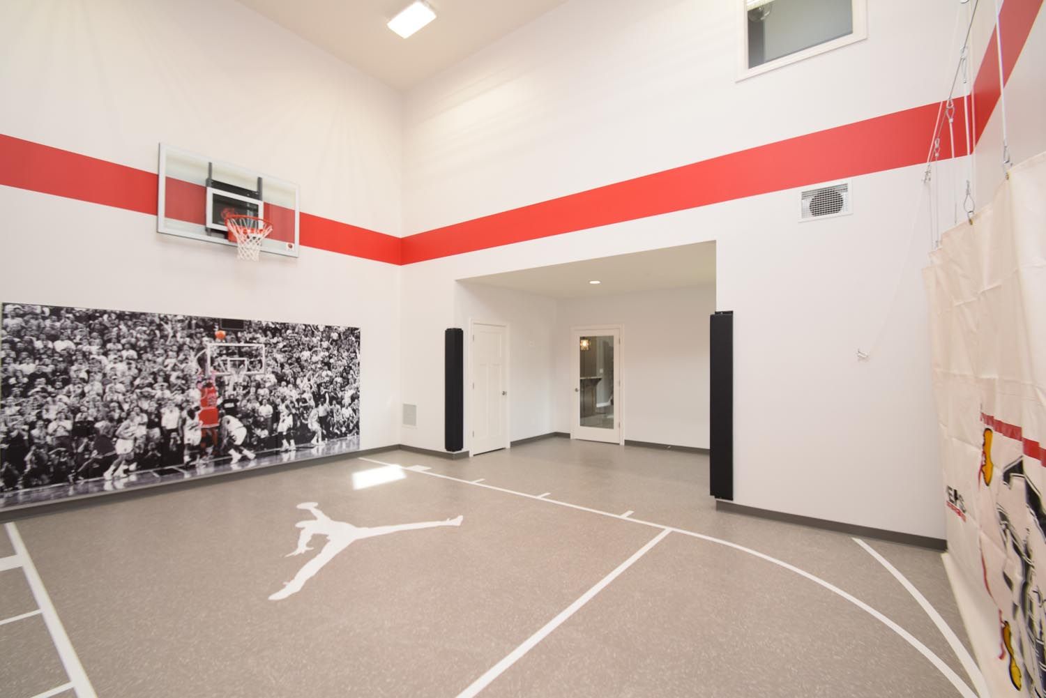 there is a basketball court in the middle of the room