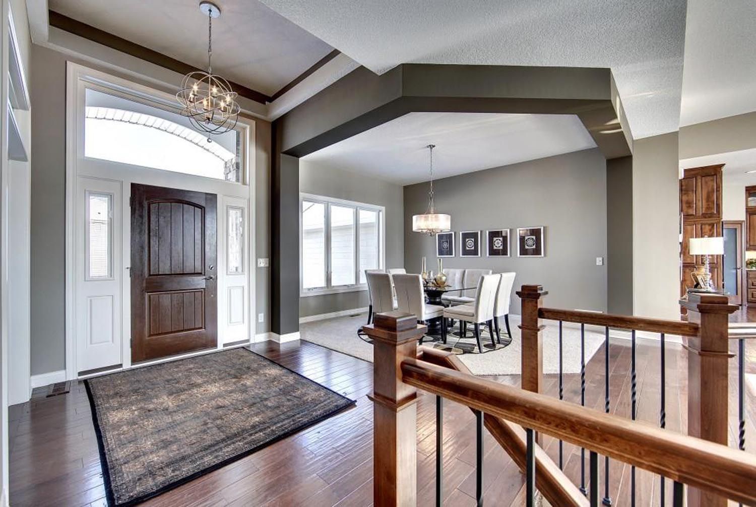 a large house with a staircase leading up to the second floor