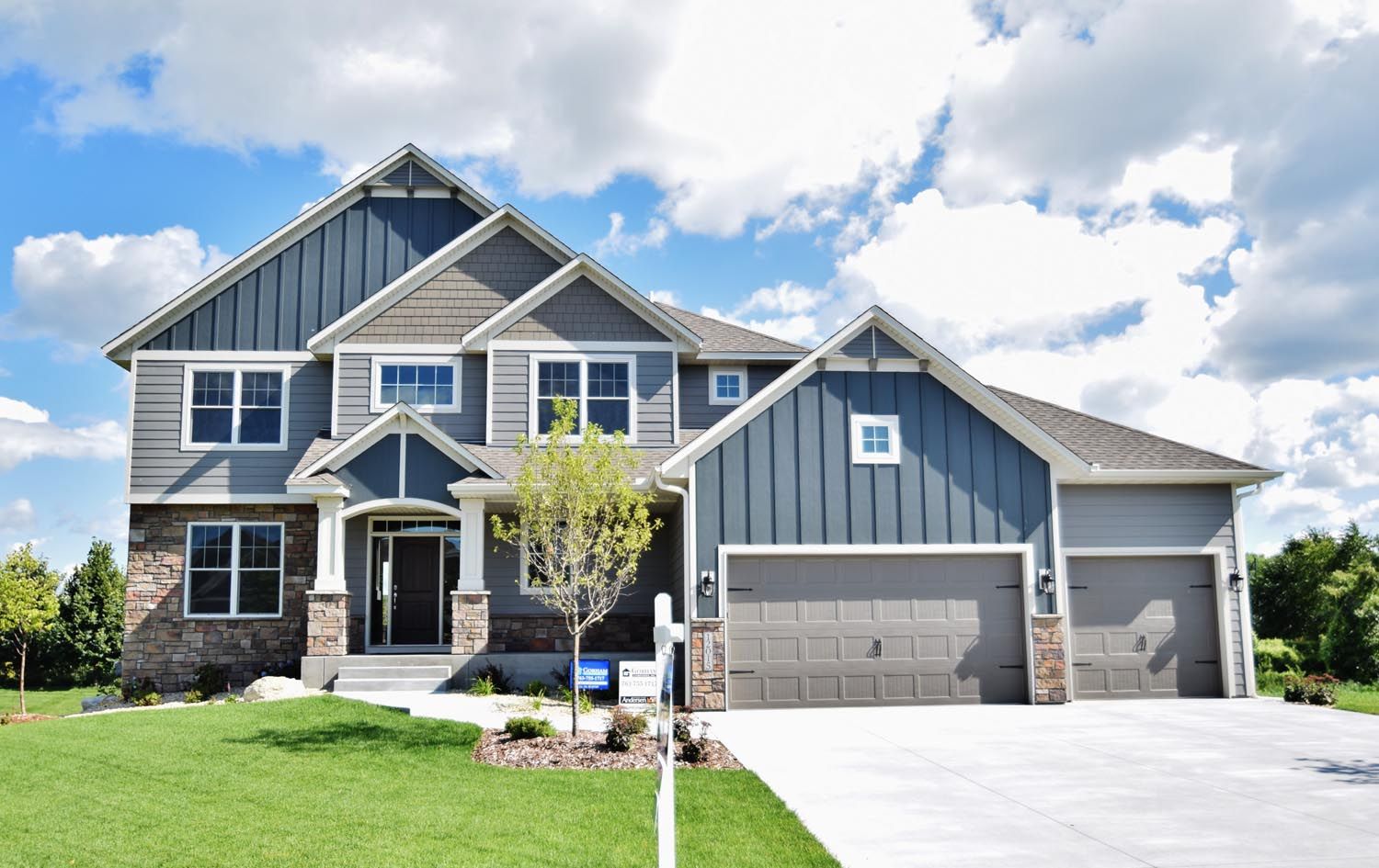 a large house with a lot of windows and a lot of garages
