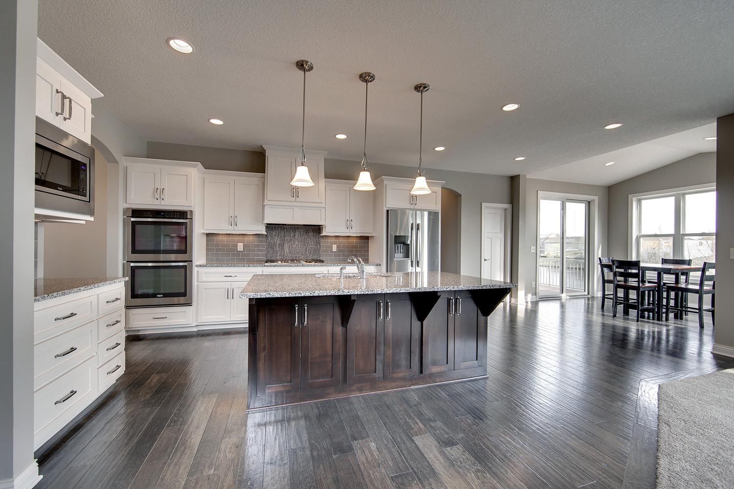 a large kitchen with a large island in the middle
