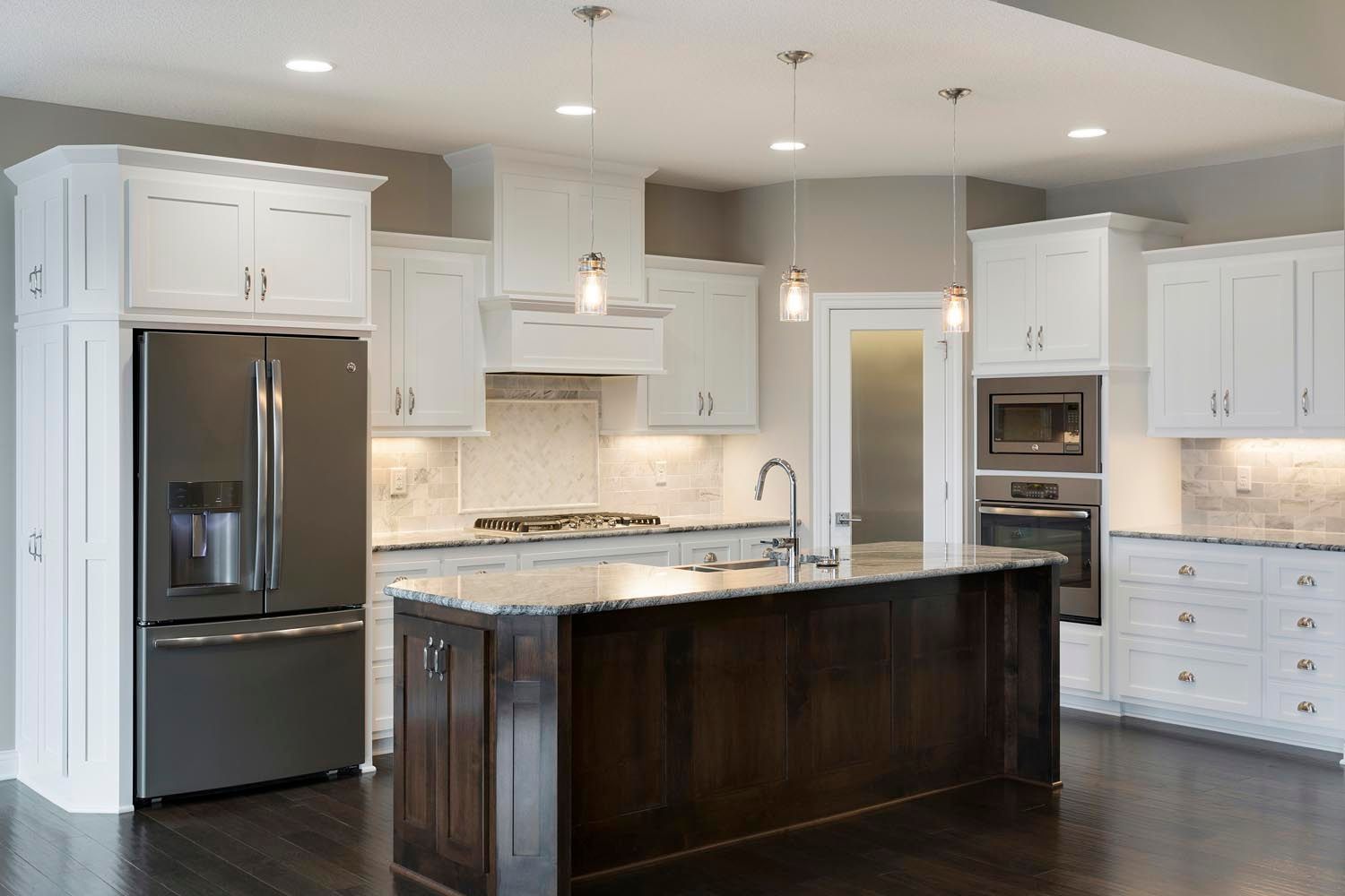 there is a large island in the middle of the kitchen