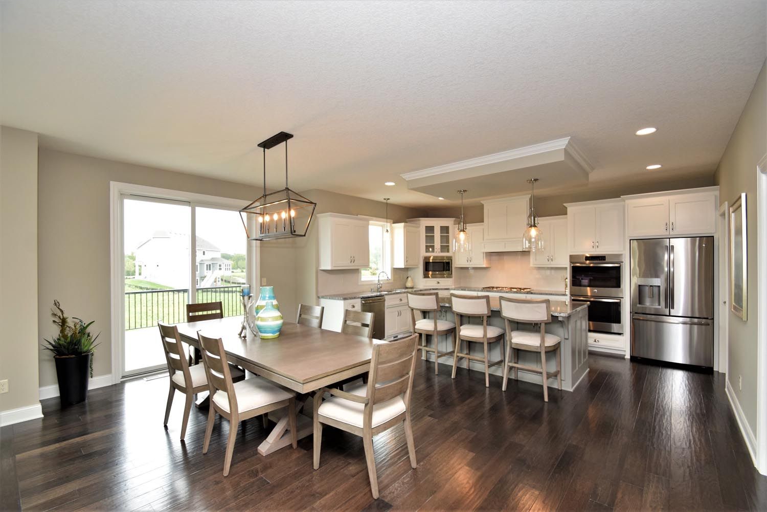 a kitchen with a table and chairs in it