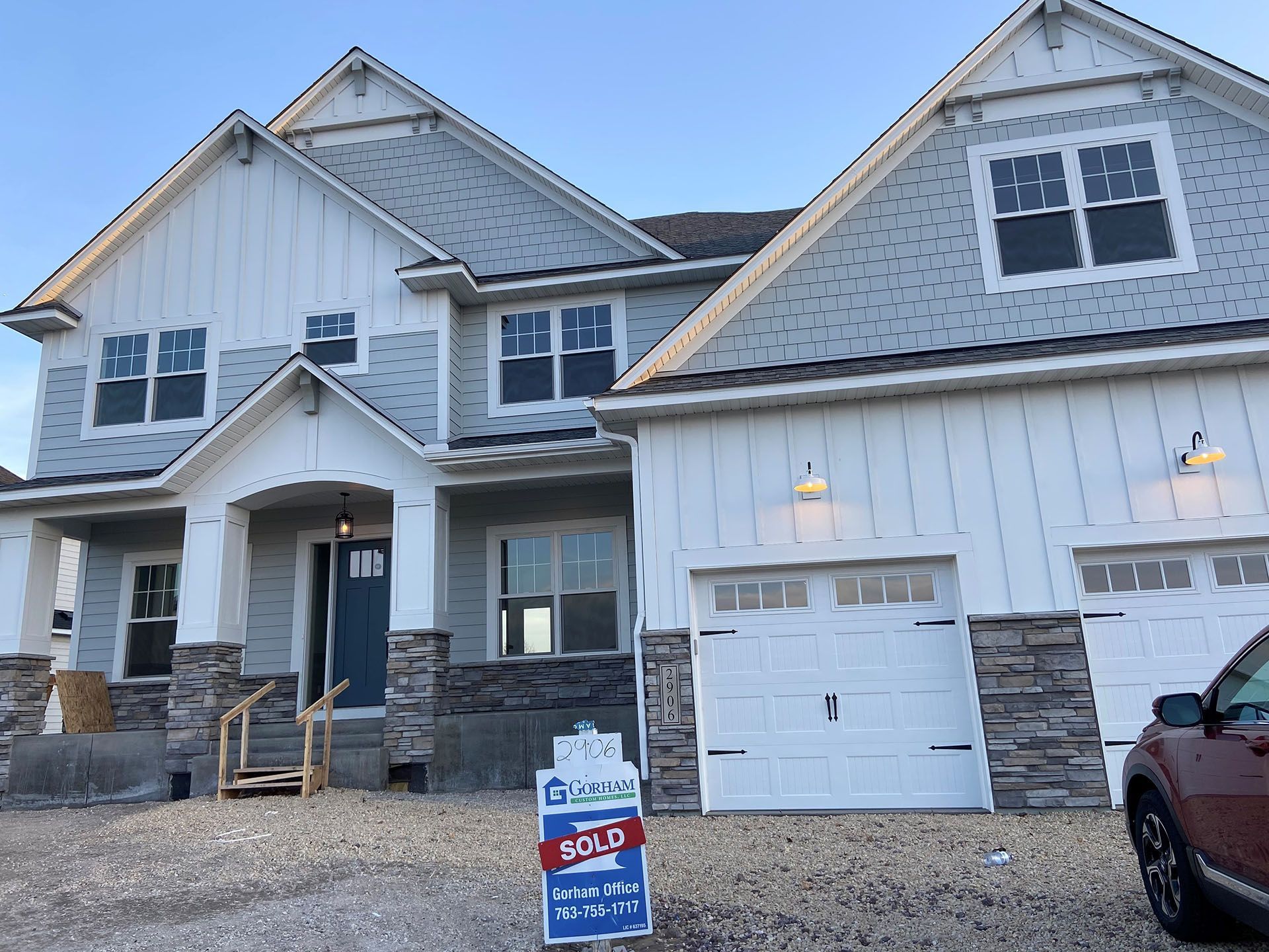 a house with a sold sign in front of it