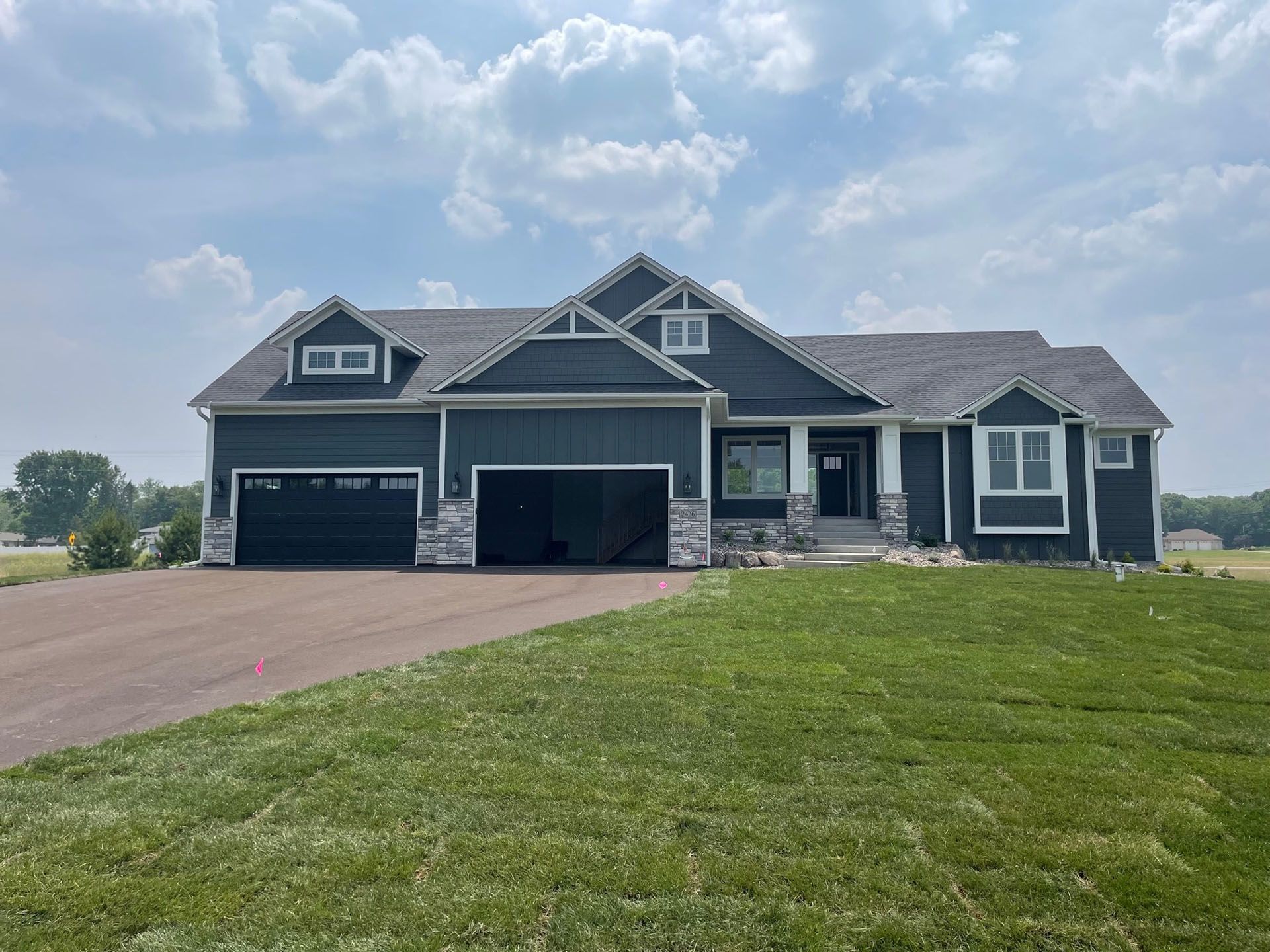 a large house with a lot of grass in front of it