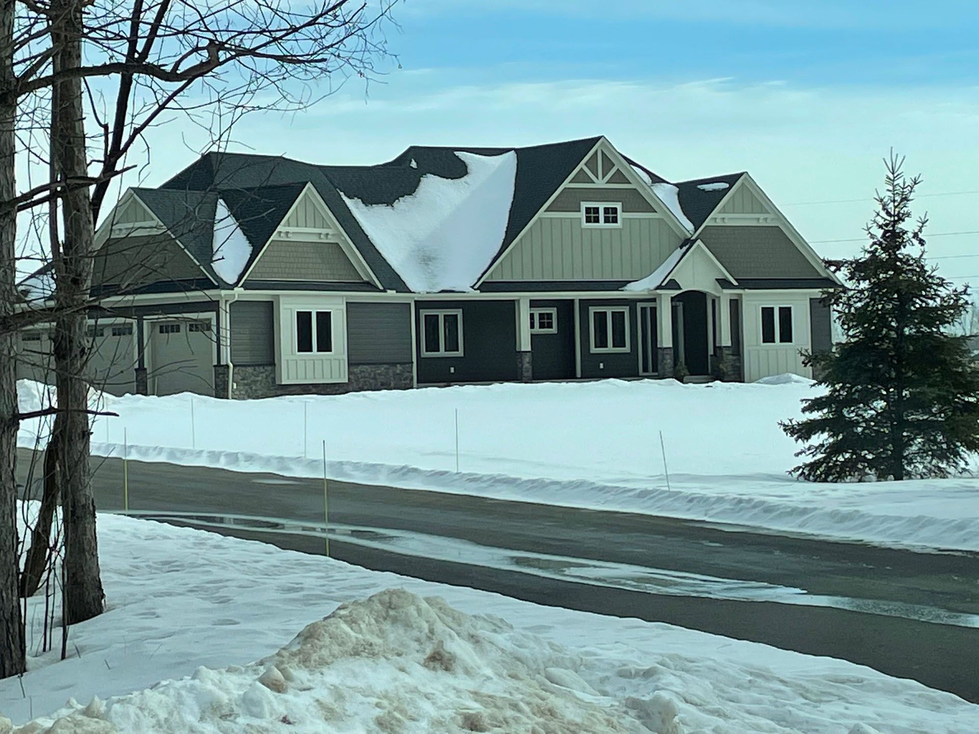 a large house is sitting on top of a snow cover