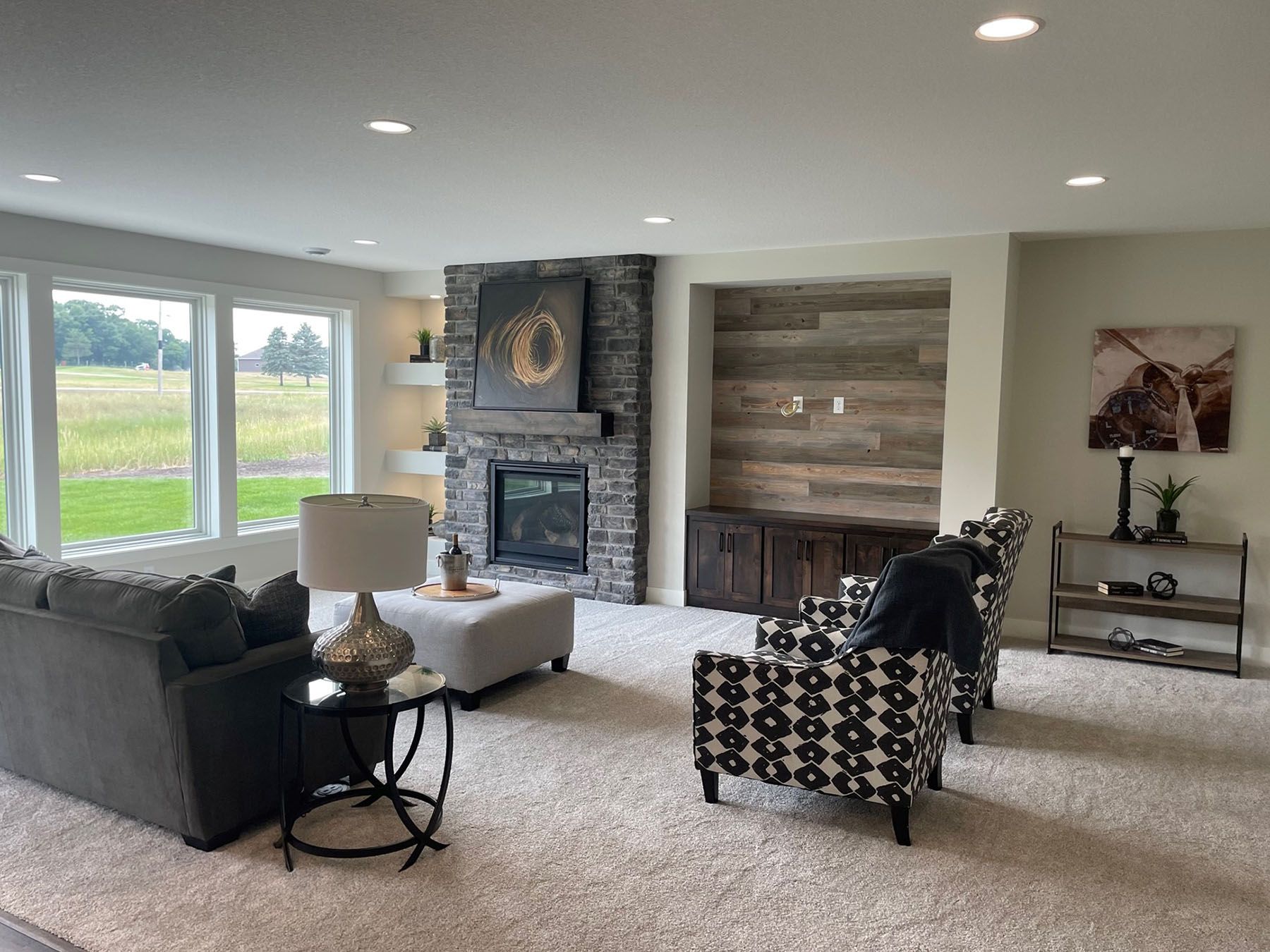 a living room filled with furniture and a fireplace