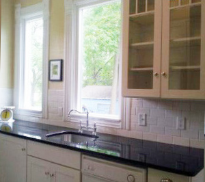 Kitchen cabinet and faucet