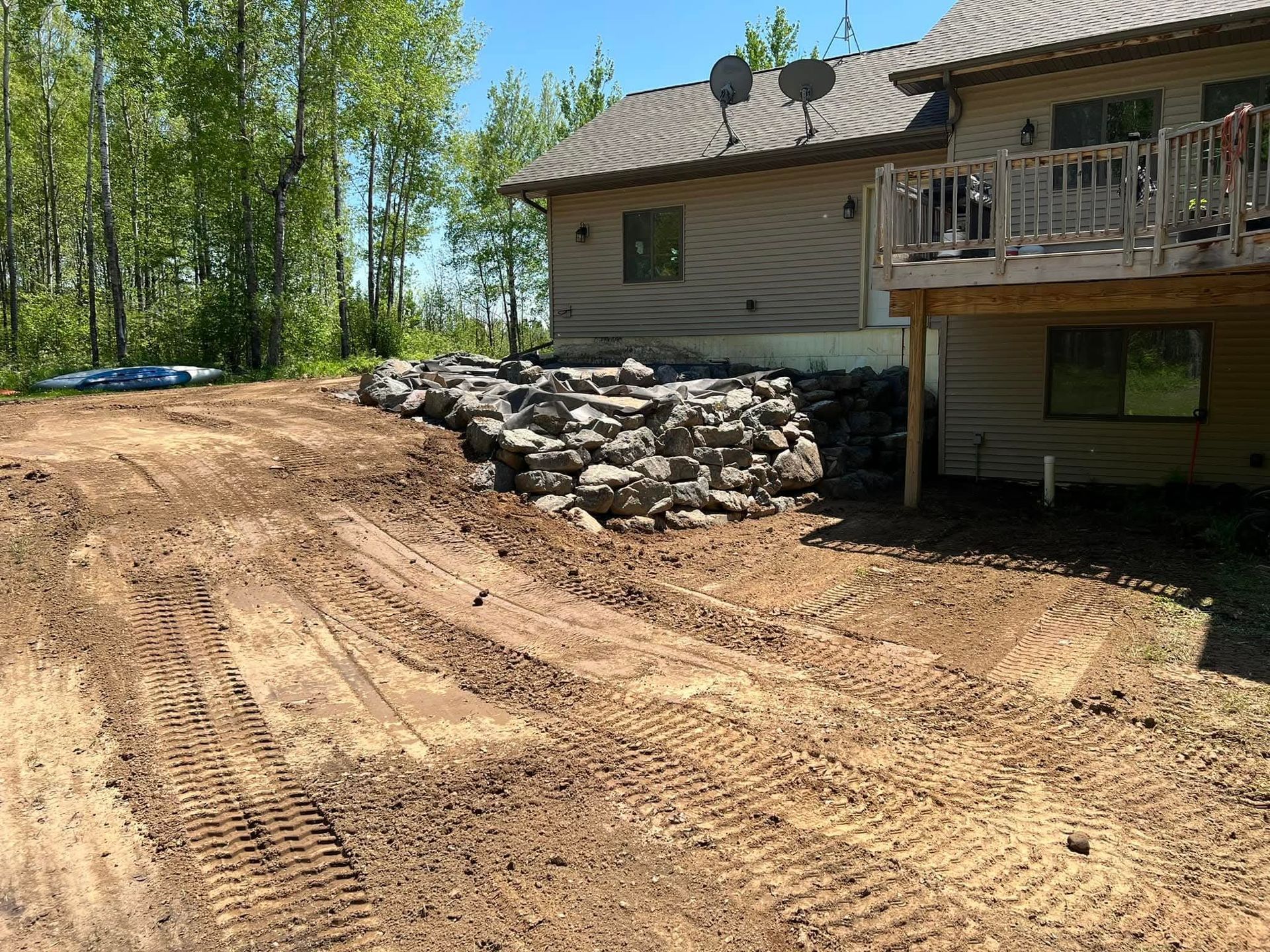 A large house with a large pile of dirt in front of it.
