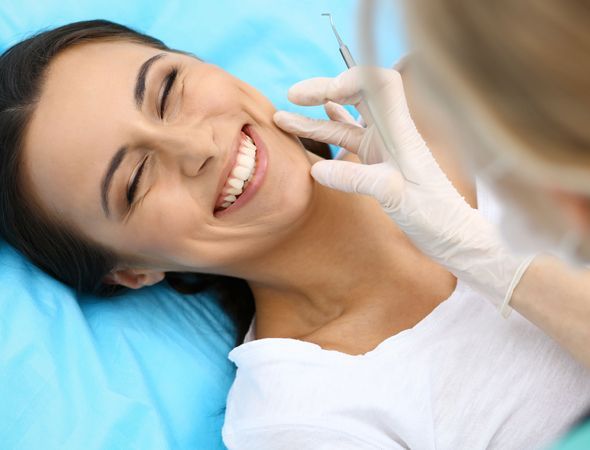 A happy patient having dental cleaning