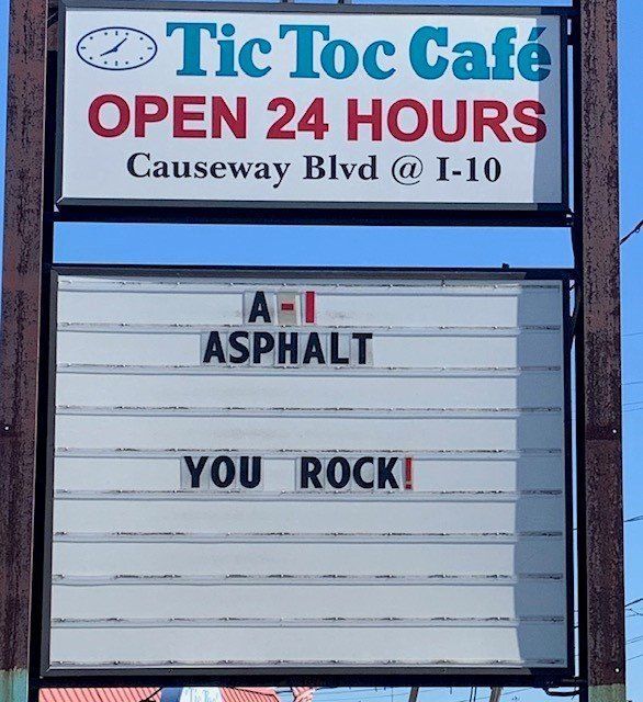 A sign that says tic toc cafe open 24 hours