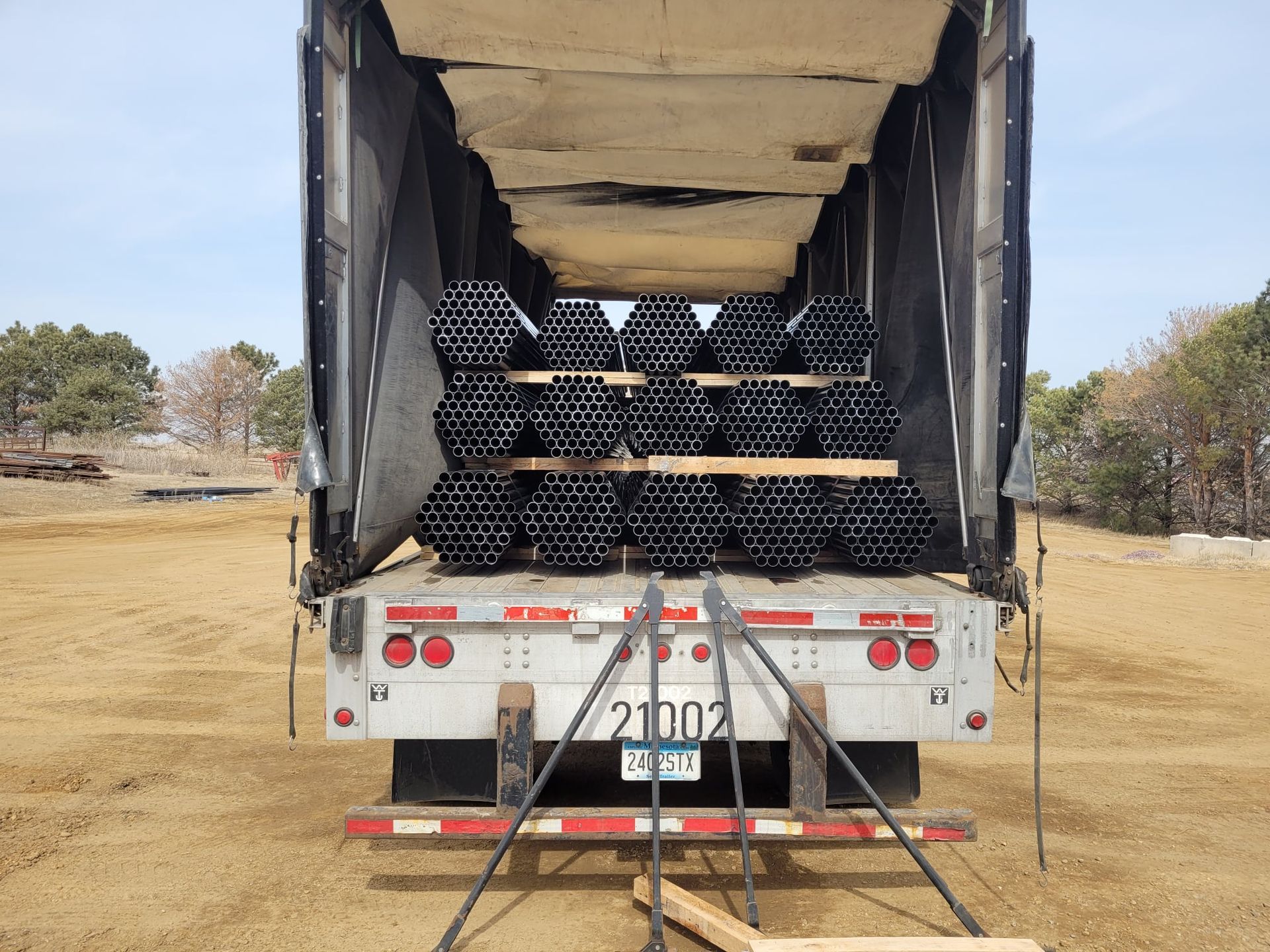 Truck carrying metal tubes